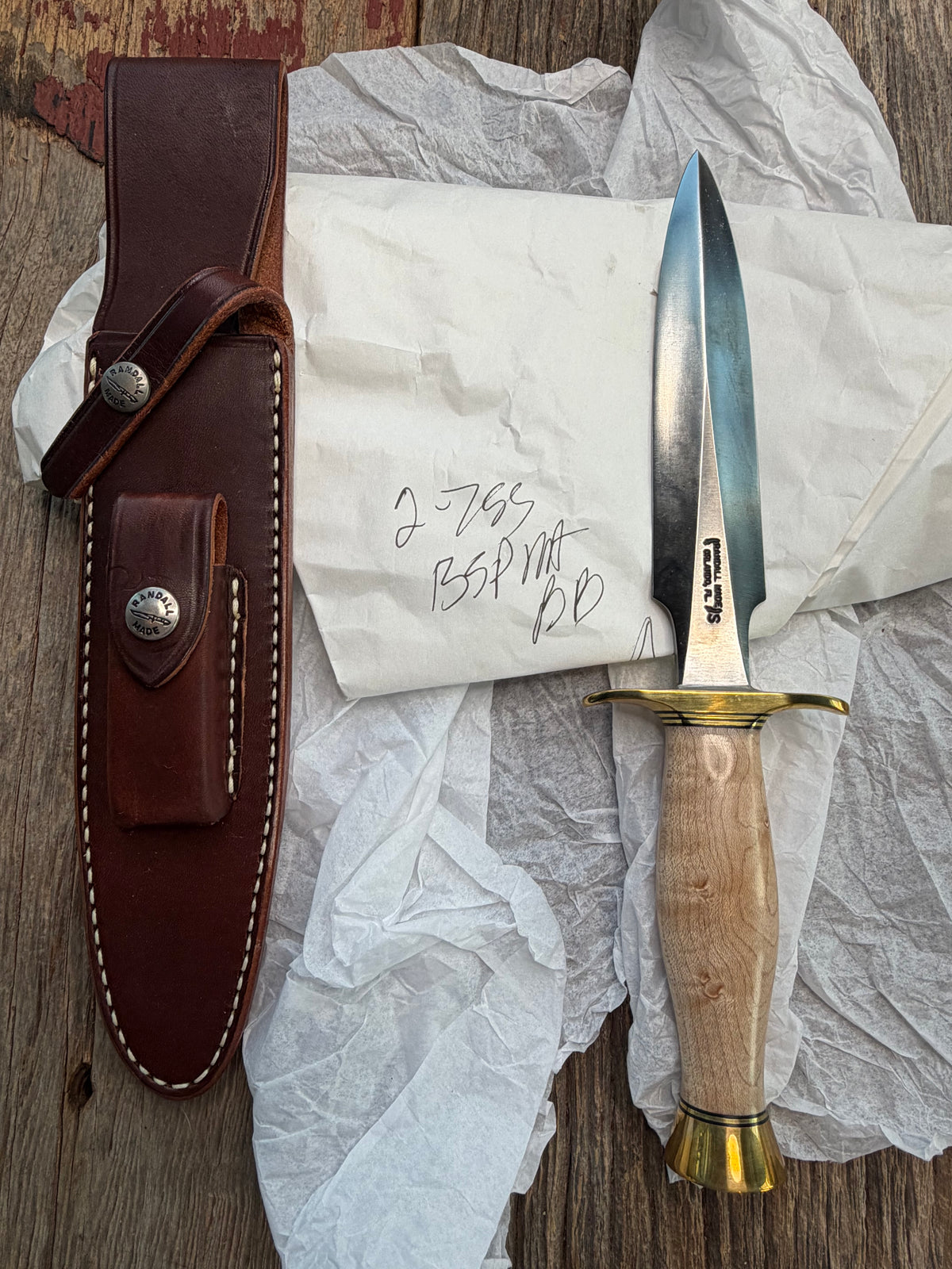 New in Paper Randall Made Knife Model 2-7 Maple wood, Stainless, Black and gold spacers, Brass Hilt and  butt cap.
