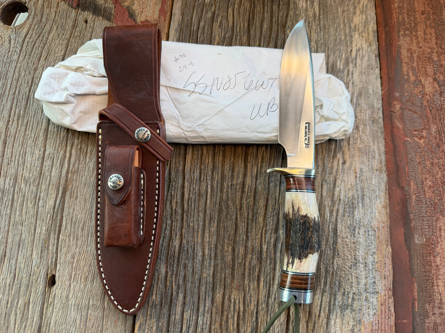 New in paper Randall Knife Model 25-6 Trapper in Stag Leather Handle Stainless Blade, NSH