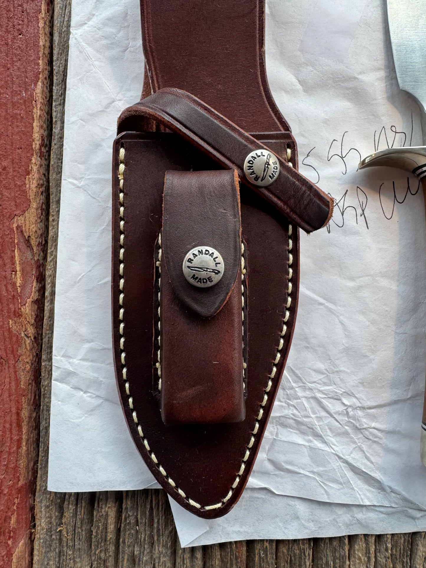 New in Paper Randall Model 19-5 Bushmaster with an Oak handle. SS blade, Nickel silver single hilt. Lanyard. Brown leather sheath.