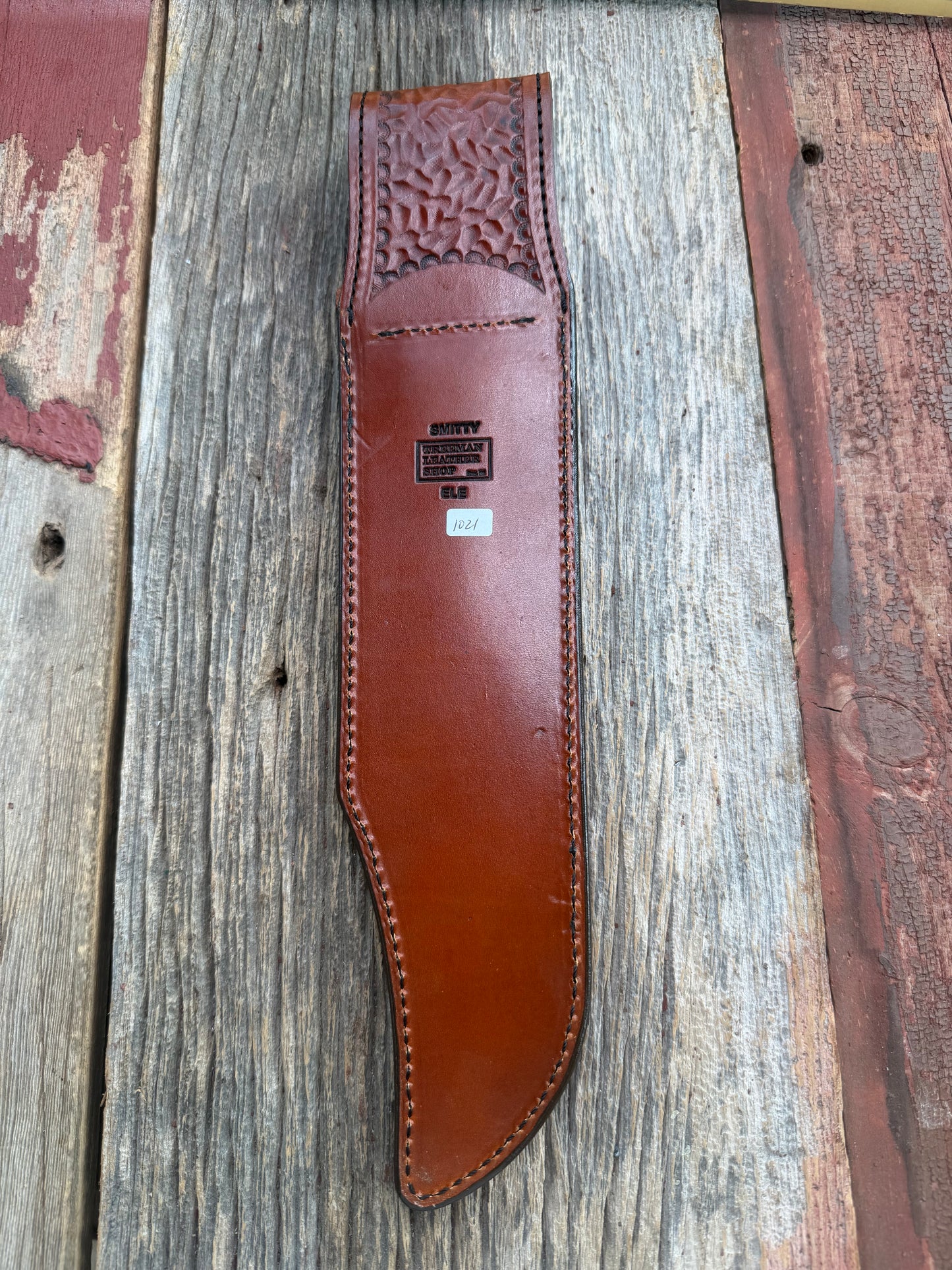 New Randall Model 12-11 Smithsonian Sheath in Exotic thick and textured Rust colored Elephant hide on brown leather from Treeman with a black Canteen snap. Hand tooled belt loop. Killer sheath.