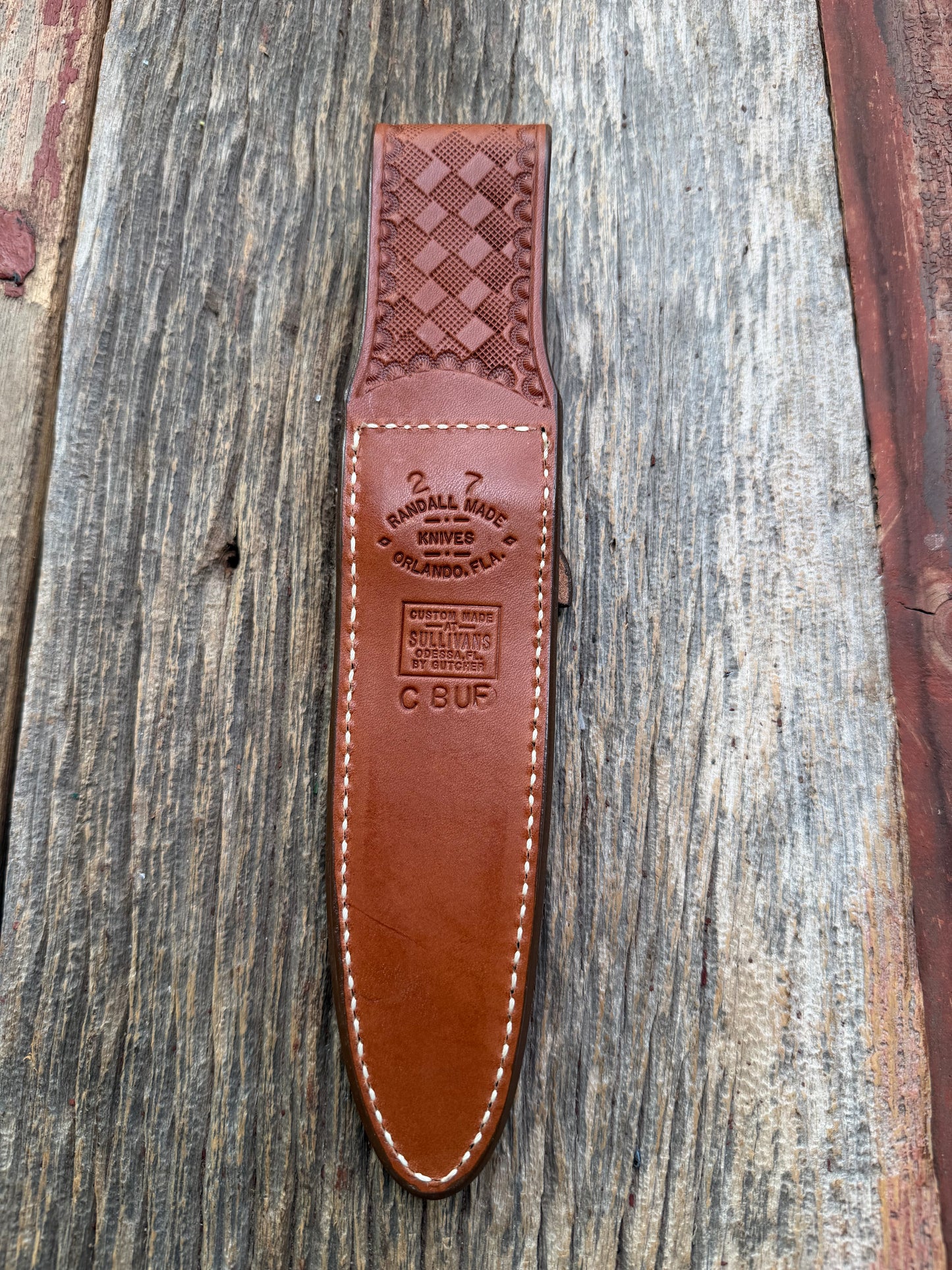 Pristine Randall Model 2-7 sheath in Exotic Cape Buffalo leather from Sullivans by Gutcher. Heavily tooled belt loop and strap. Randall snap and clean stamping on the back … perfect!!