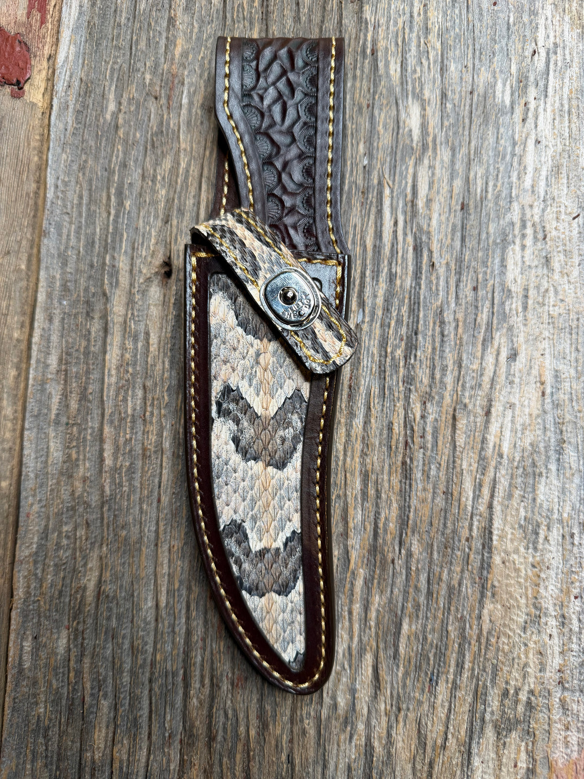 Randall Model 27 sheath with a Canebrake RattleSnake skin from Treeman Sheaths. Vibrant colors and along side Copperheads the hardest skin to source.