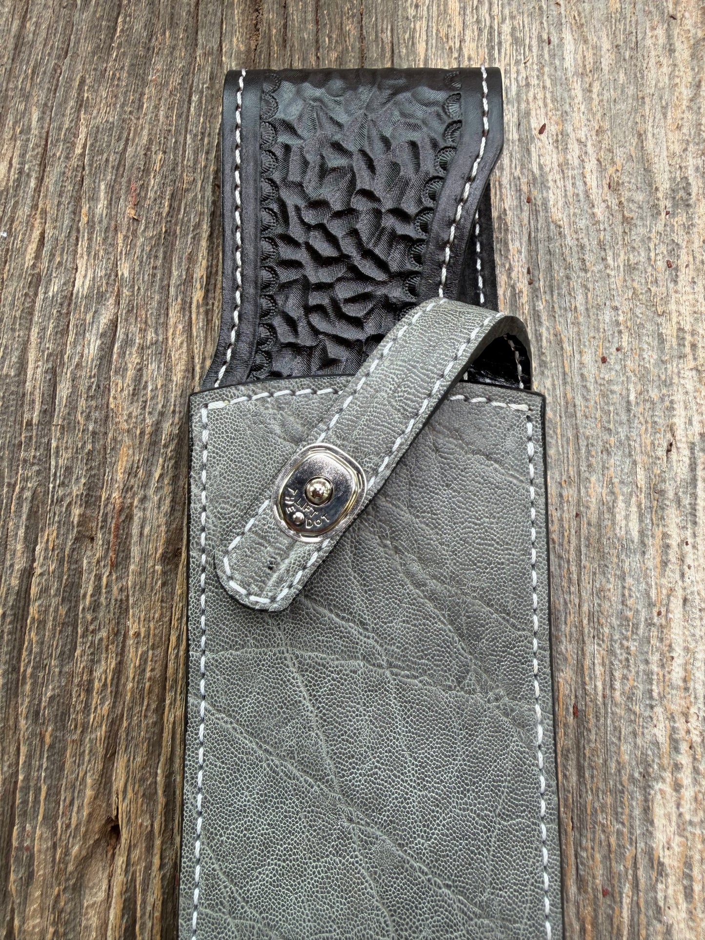 New Randall Model 12-11 Large Sasquatch Sheath in Exotic thick and textured Grey Elephant Hide on black leather from Treeman with a silver Canteen snap. Hand tooled belt loop. Killer sheath.