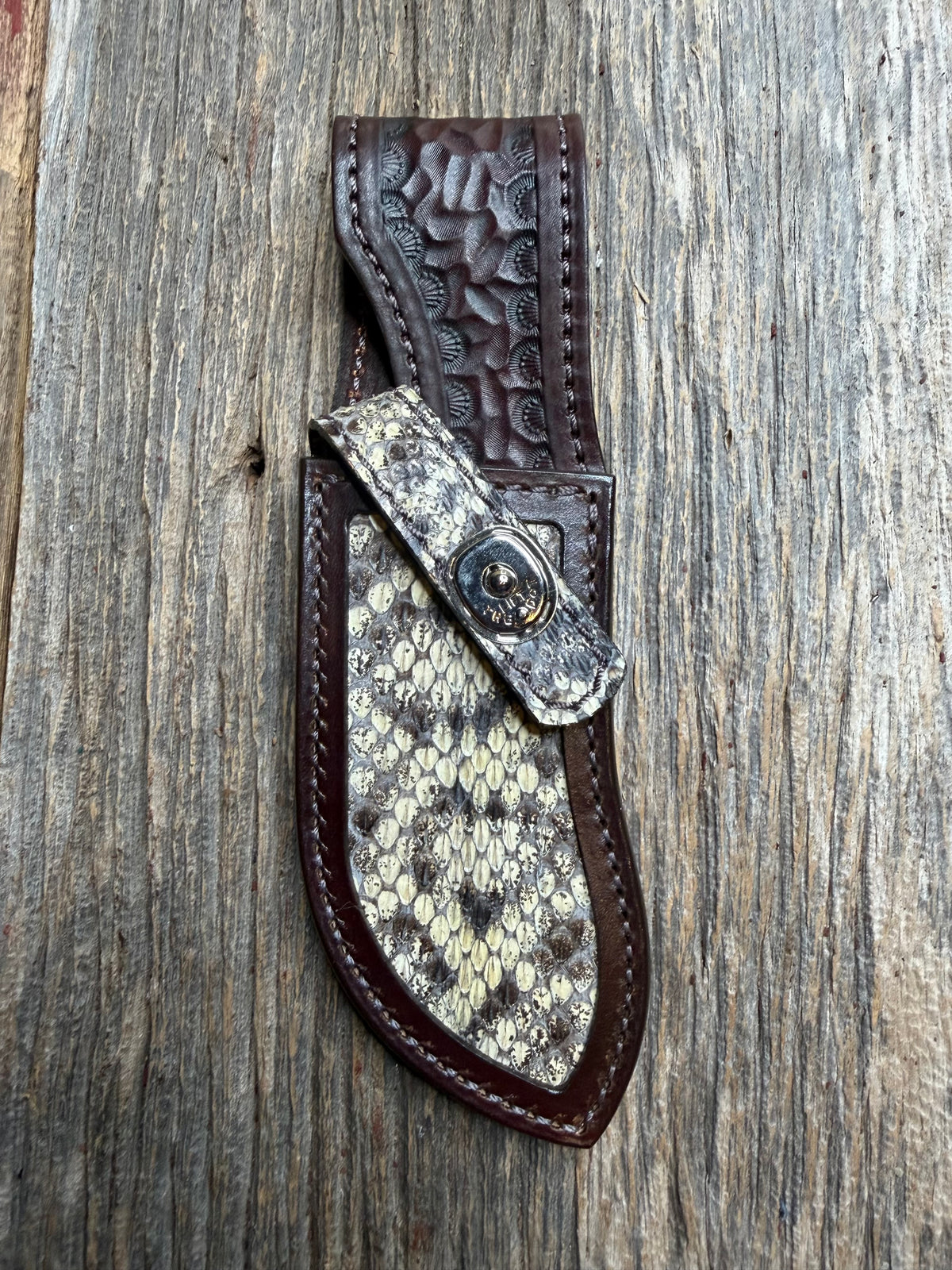 Randall Model Bowles Special sheath with an Eastern Diamondback RattleSnake skin from Treeman Sheaths. Hand tooled belt loop, canteen snap. Vibrant colors and one of the hardest skins to source.