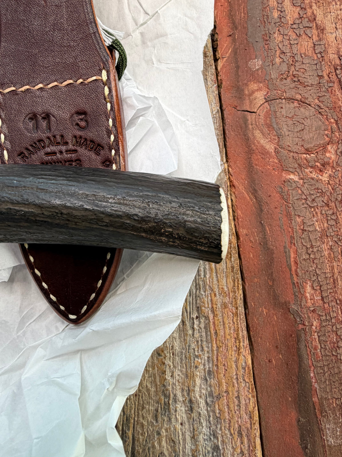 New in paper Randall Model 11-3 Alaskan Skinner in Stag with a natural end. Carbon steel blade, Brass Single hilt and Brown leather sheath.