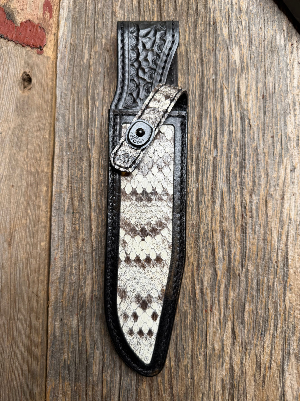 Randall Model 1-7 sheath with an Eastern Diamondback RattleSnake skin from Treeman Sheaths. Hand tooled belt loop, canteen snap. One the hardest skins to source.