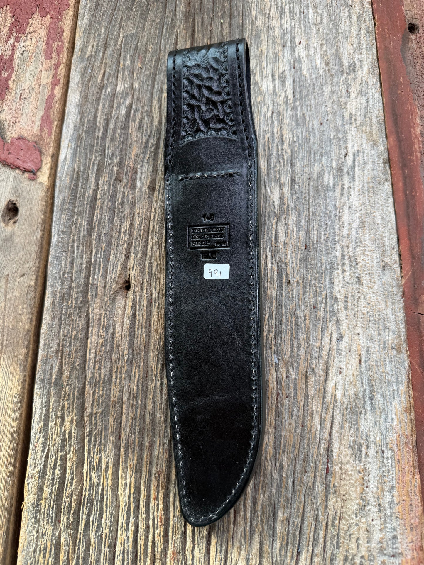 New Randall Model 1-8 Sheath in Exotic thick and textured Grey Elephant Hide on black leather from Treeman with a black Canteen snap. Hand tooled belt loop. Killer sheath.