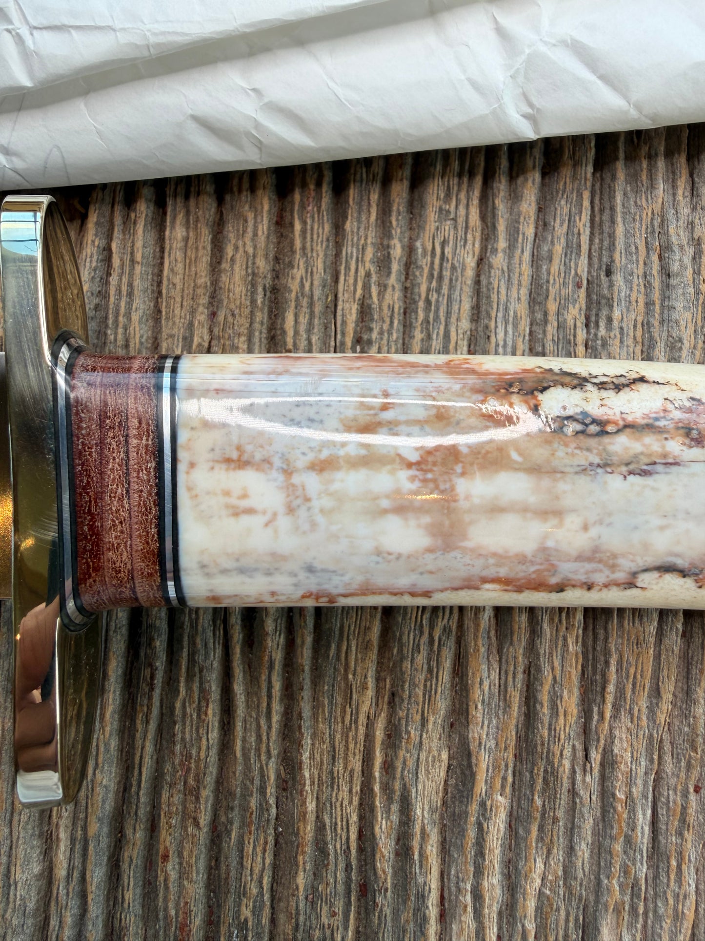 New in Paper Randall Model 12-9 Fossil Walrus Ivory and 25 style stacked Leather grip. Double Nickel Silver hilt and nickel butt cap.