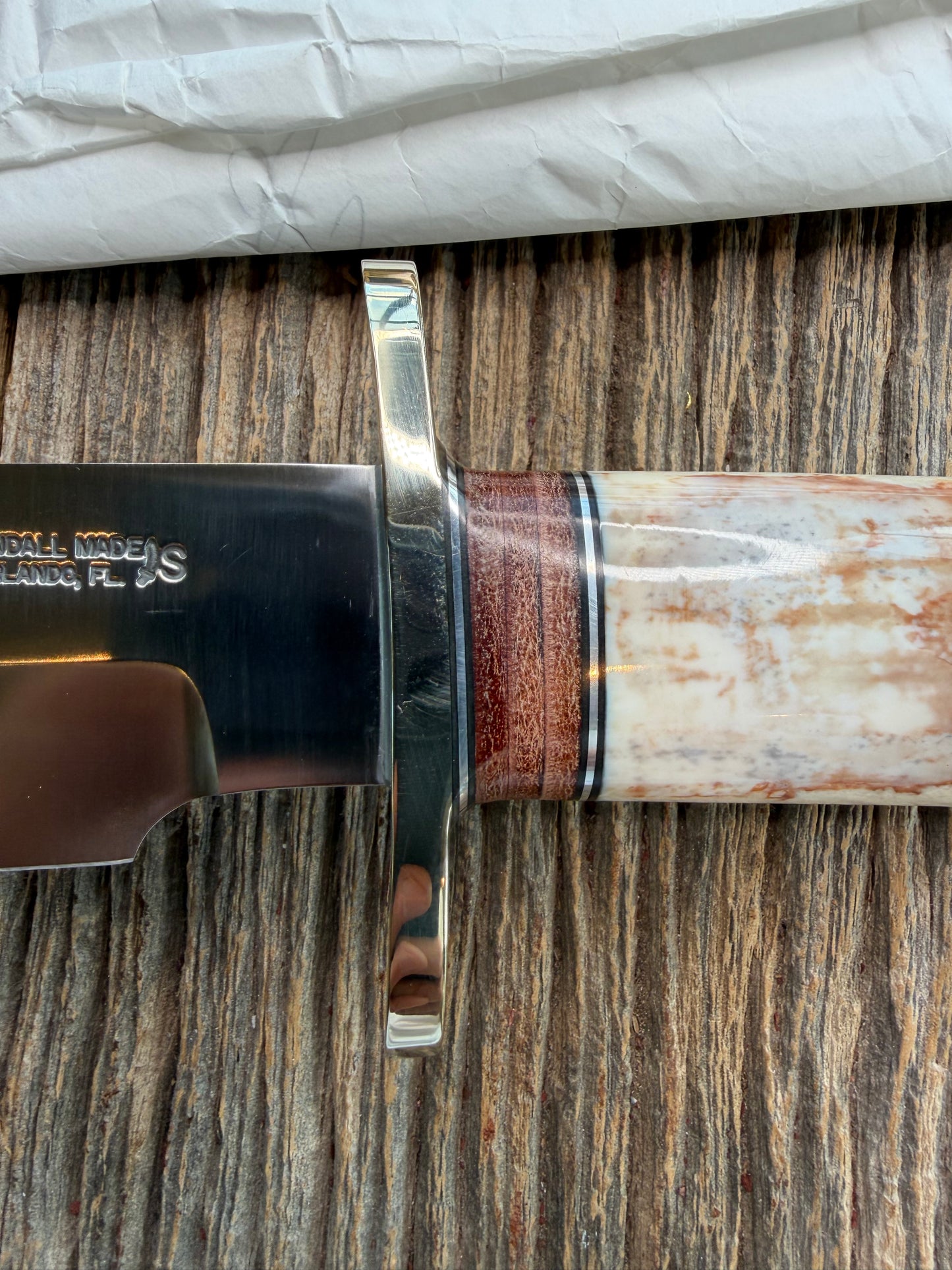 New in Paper Randall Model 12-9 Fossil Walrus Ivory and 25 style stacked Leather grip. Double Nickel Silver hilt and nickel butt cap.