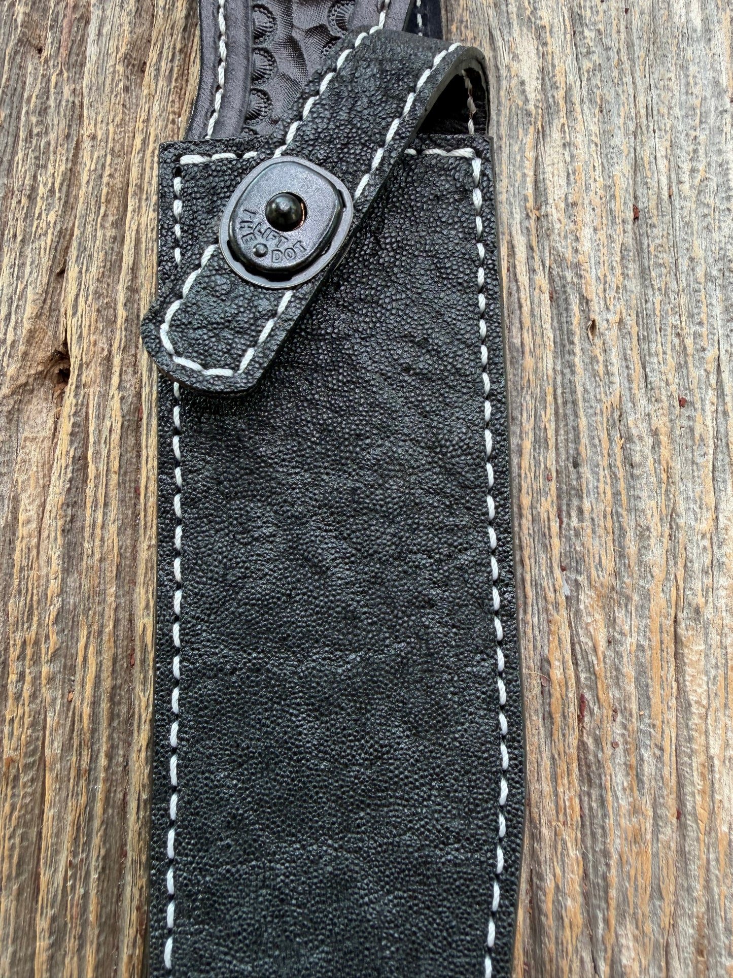New Randall Model 1-7 Sheath in Exotic thick and textured Black Elephant hide on black leather from Treeman with a black Canteen snap. Hand tooled belt loop. Killer sheath.