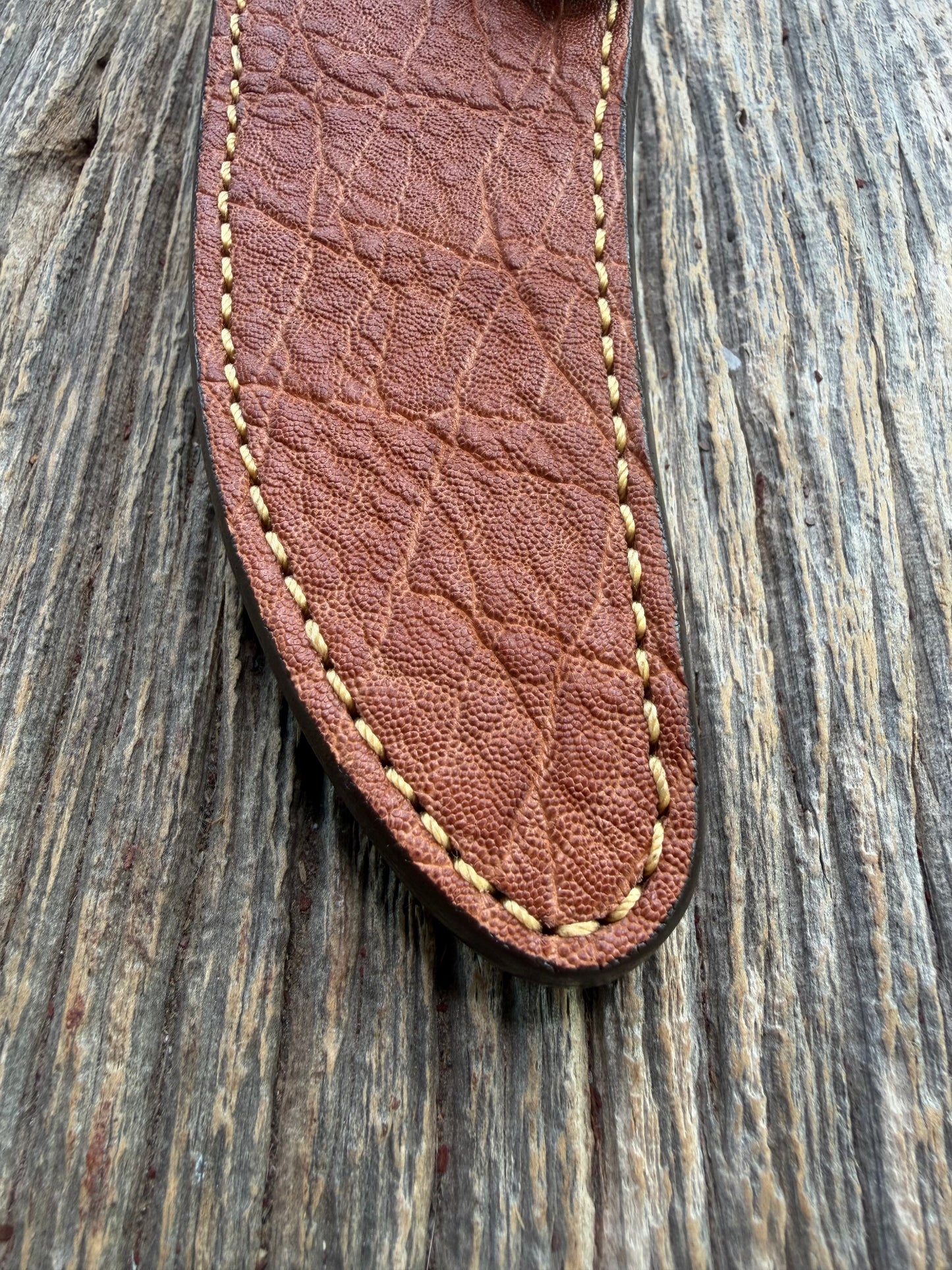 New Randall Model 27 Sheath in Exotic thick and textured Rust colored Elephant hide on brown leather from Treeman with a silver Canteen snap. Hand tooled belt loop. Killer sheath.