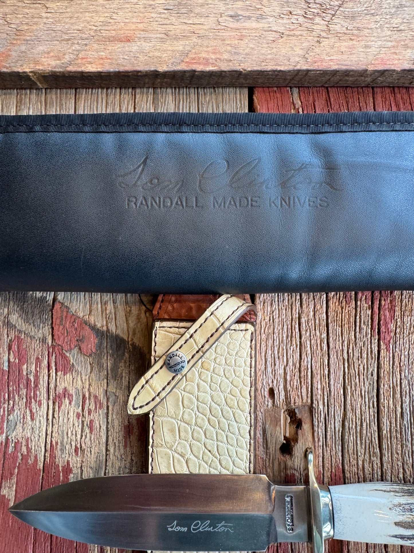Randall Tom Clinton Dealer Special. Clinton Blade etched Commemorative 1/100 in a nice piece of Stag. Very cool Ostrich Gutcher sheath. Nickel Silver Hilt and Nickel Butt cap. Included in black facsimile Tom Clinton case.