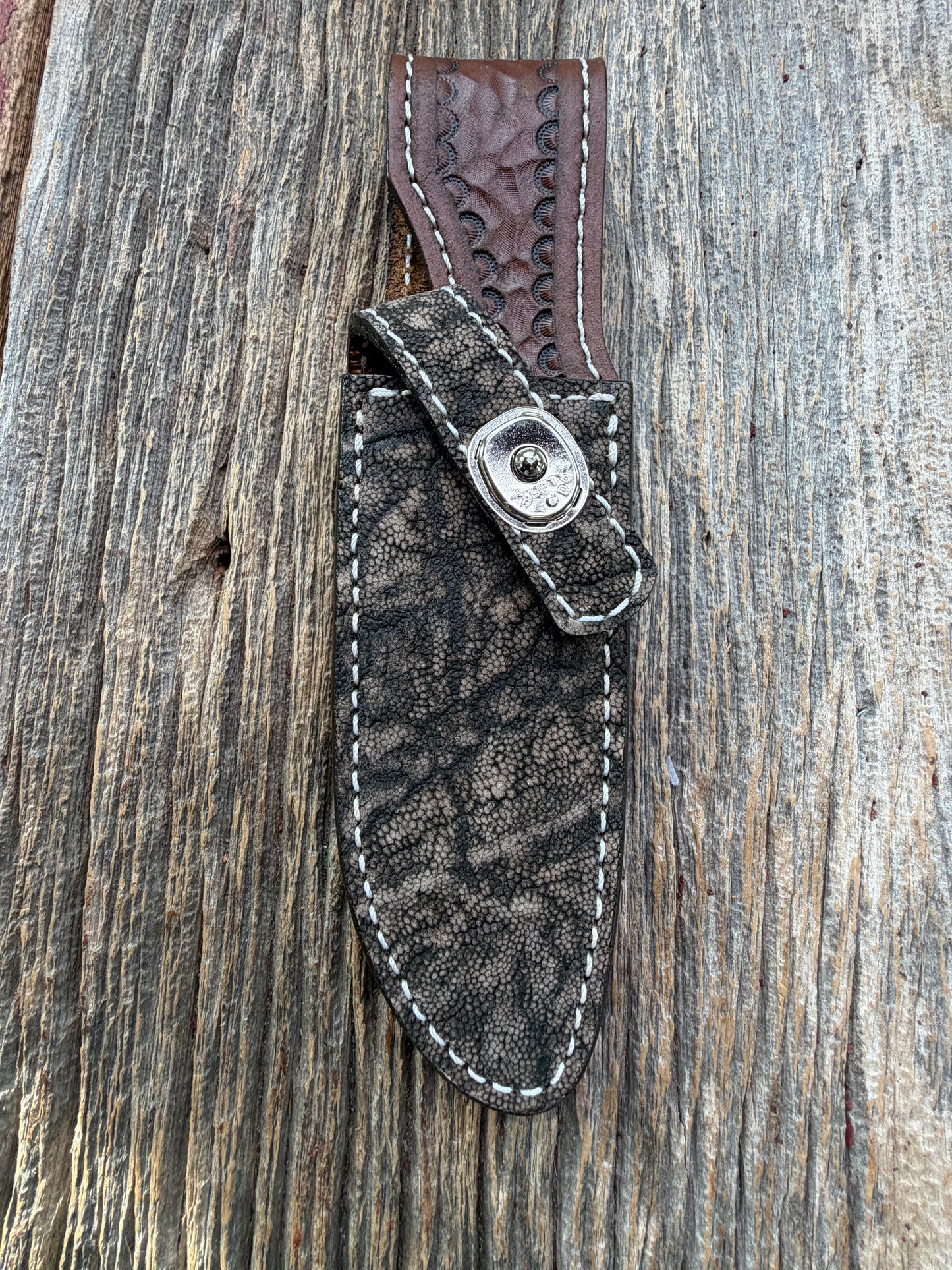 New Randall Model 23 Sheath in Exotic thick and textured Black and Grey Elephant Ear  on brown leather from Treeman with a silver Canteen snap. Hand tooled belt loop. Killer sheath.