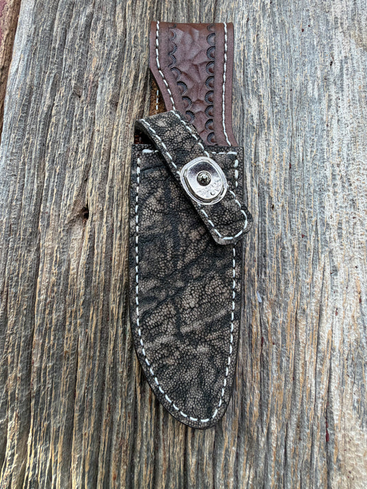 New Randall Model 23 Sheath in Exotic thick and textured Black and Grey Elephant Ear  on brown leather from Treeman with a silver Canteen snap. Hand tooled belt loop. Killer sheath.