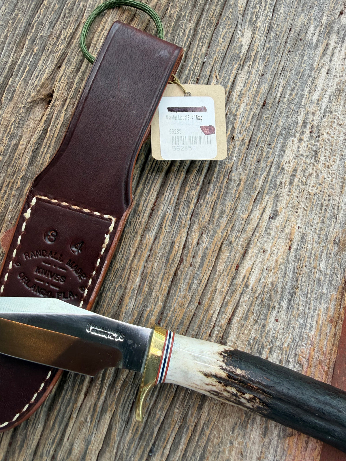 New Randall Model 8-4 with a Stag handle. Stainless steel blade, brass single hilt and natural butt. Red white and Blue spacers.