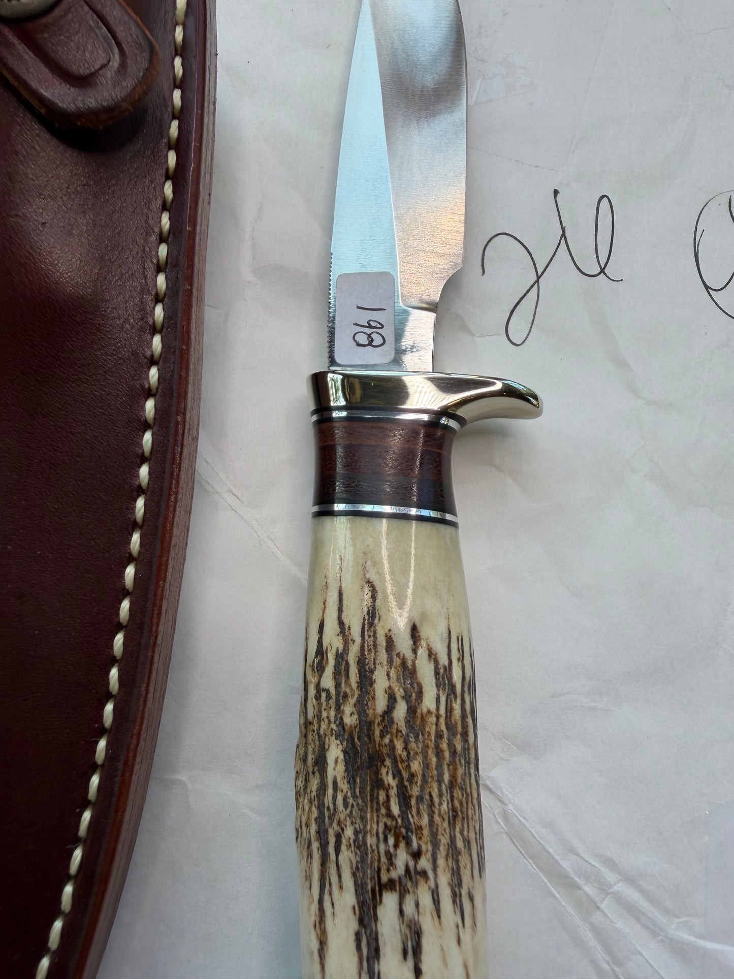 New in paper Randall Knife Model 26 Pathfinder. Stag, Black and Aluminum and leather spacers, Lanyard, NSH and buttcap.