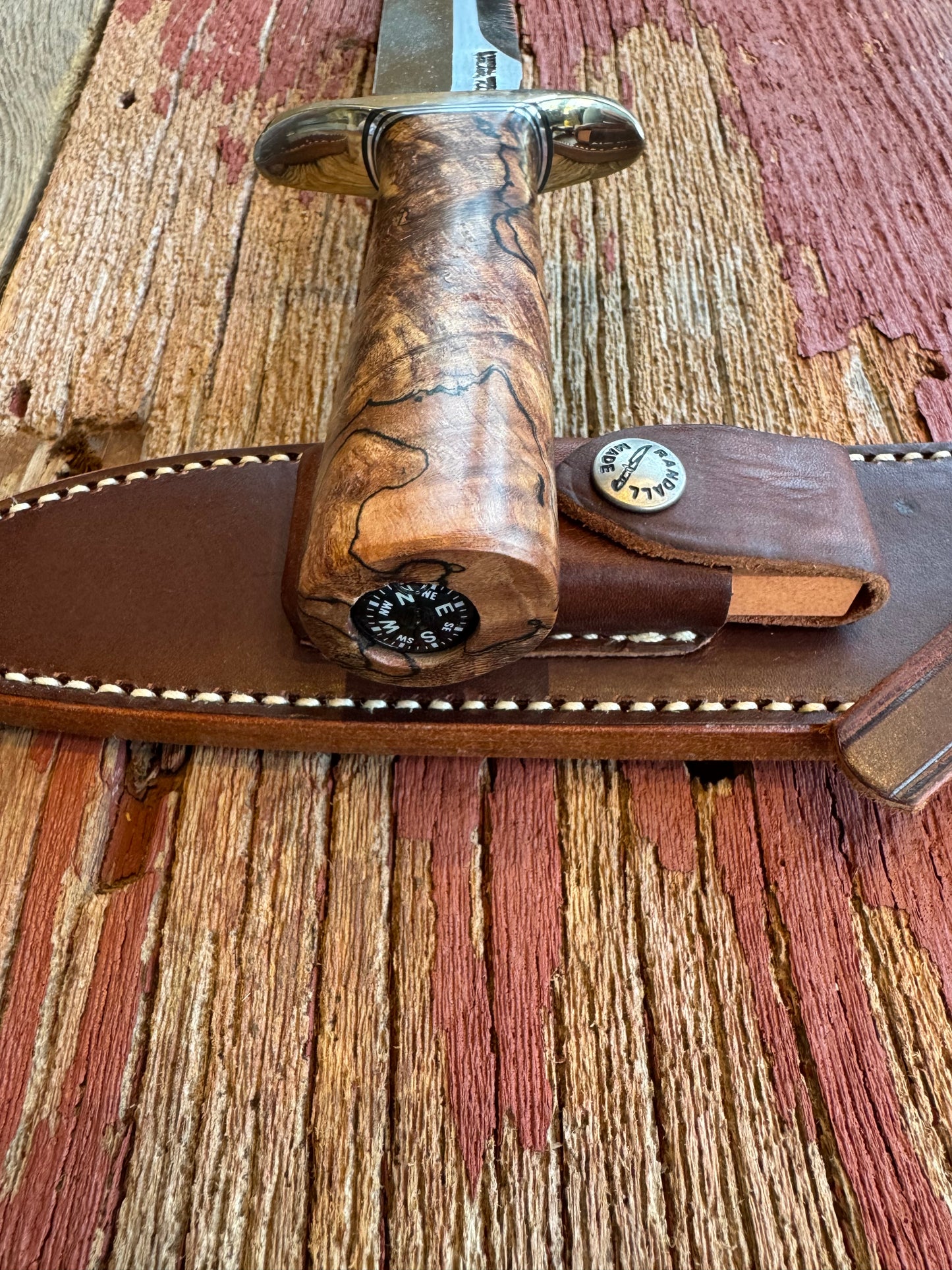New in paper Randall Knife Model 1-7 Spalted Ebony wood Handle. Carbon Steel Blade, compass and Sawteeth.