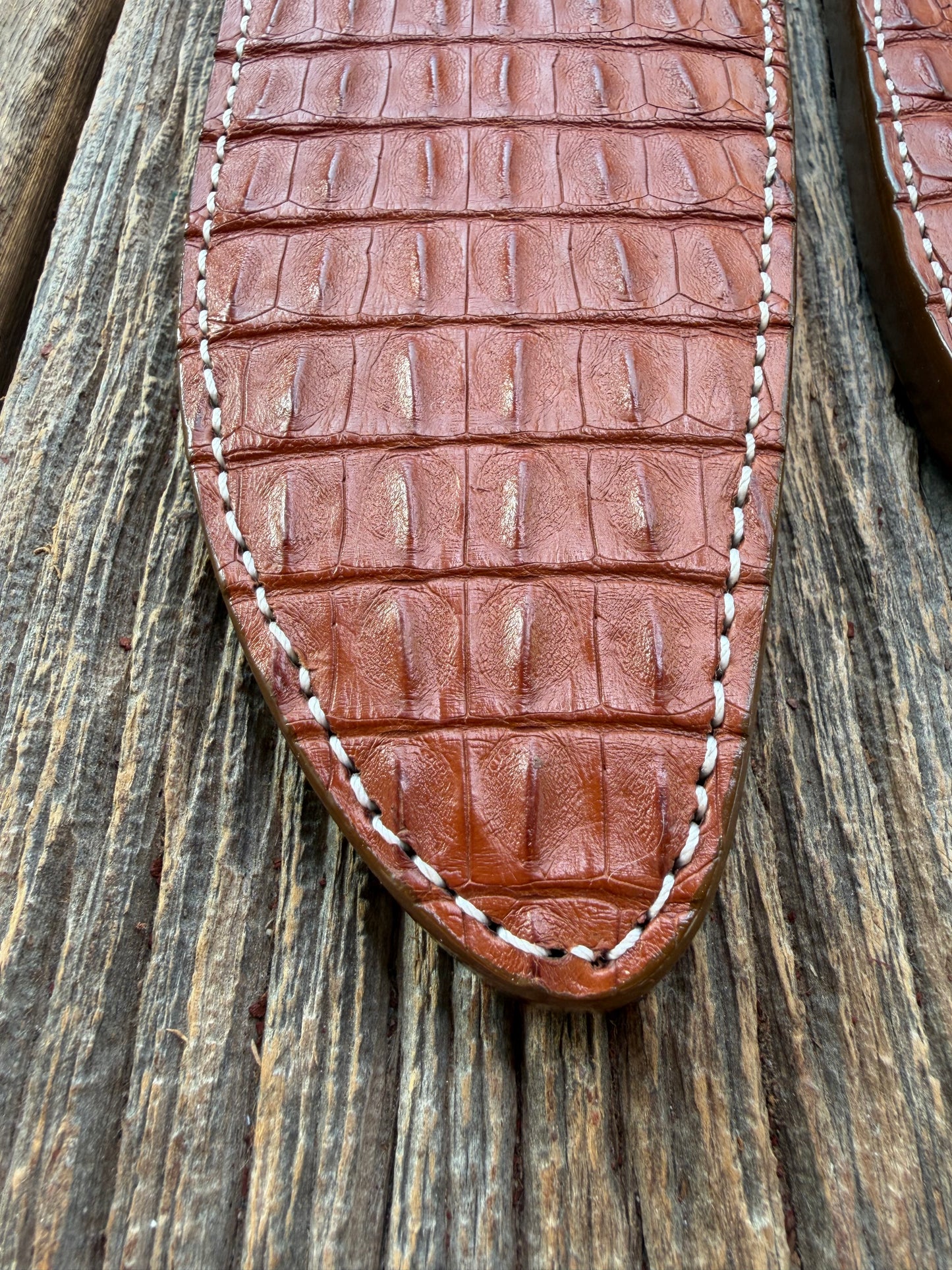 Pair of new Randall Model 12-11 Large and Small Sasquatch Sheaths in Exotic thick and textured Honey Crocodile skin ( skull portion) on brown leather from Treeman with a silver Canteen snap. Hand tooled belt loop. Killer sheath.