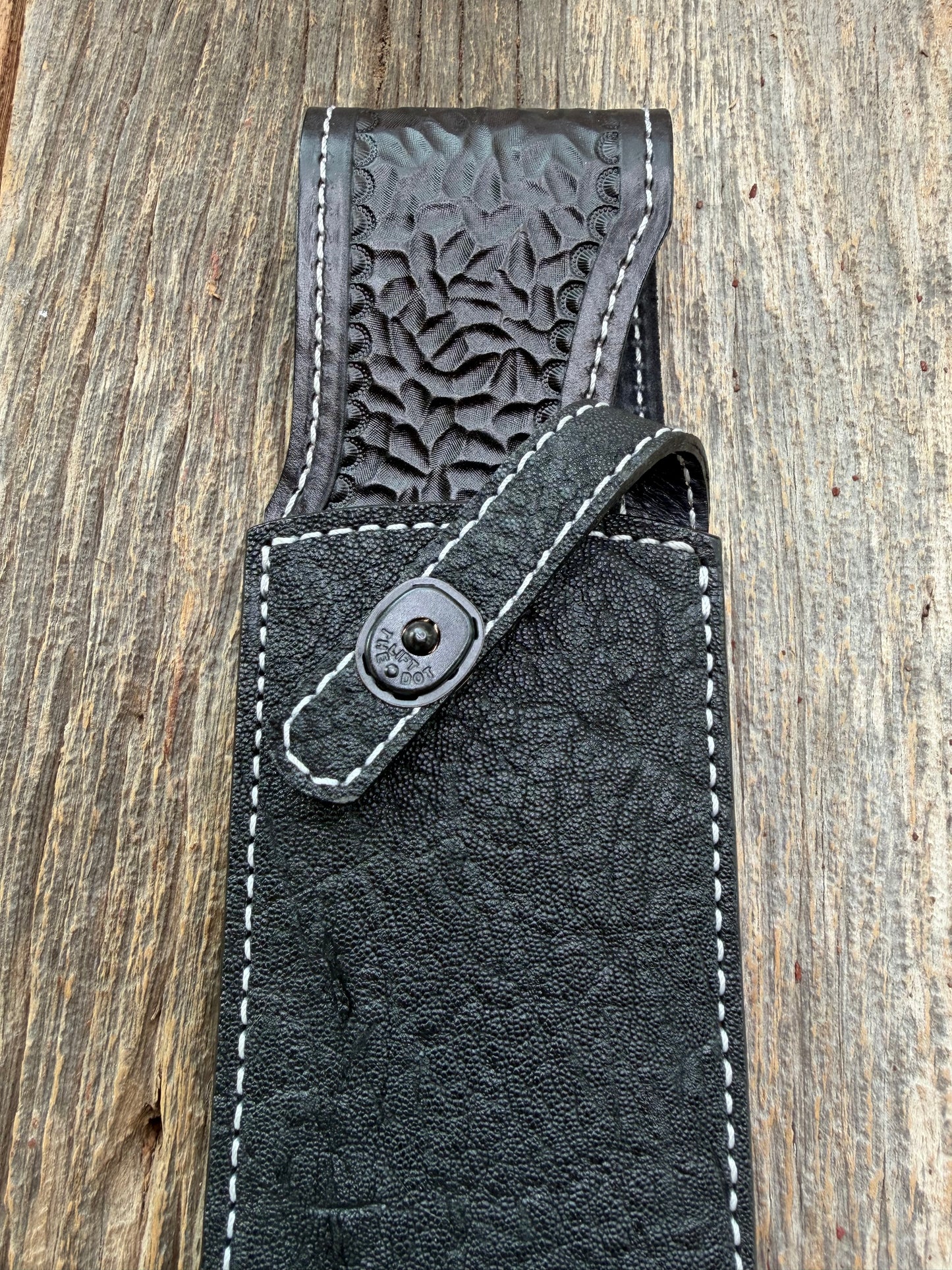 New Randall Model 12-11 Large Sasquatch Sheath in Exotic thick and textured Black Elephant hide on black leather from Treeman with a black Canteen snap. Hand tooled belt loop. Killer sheath.