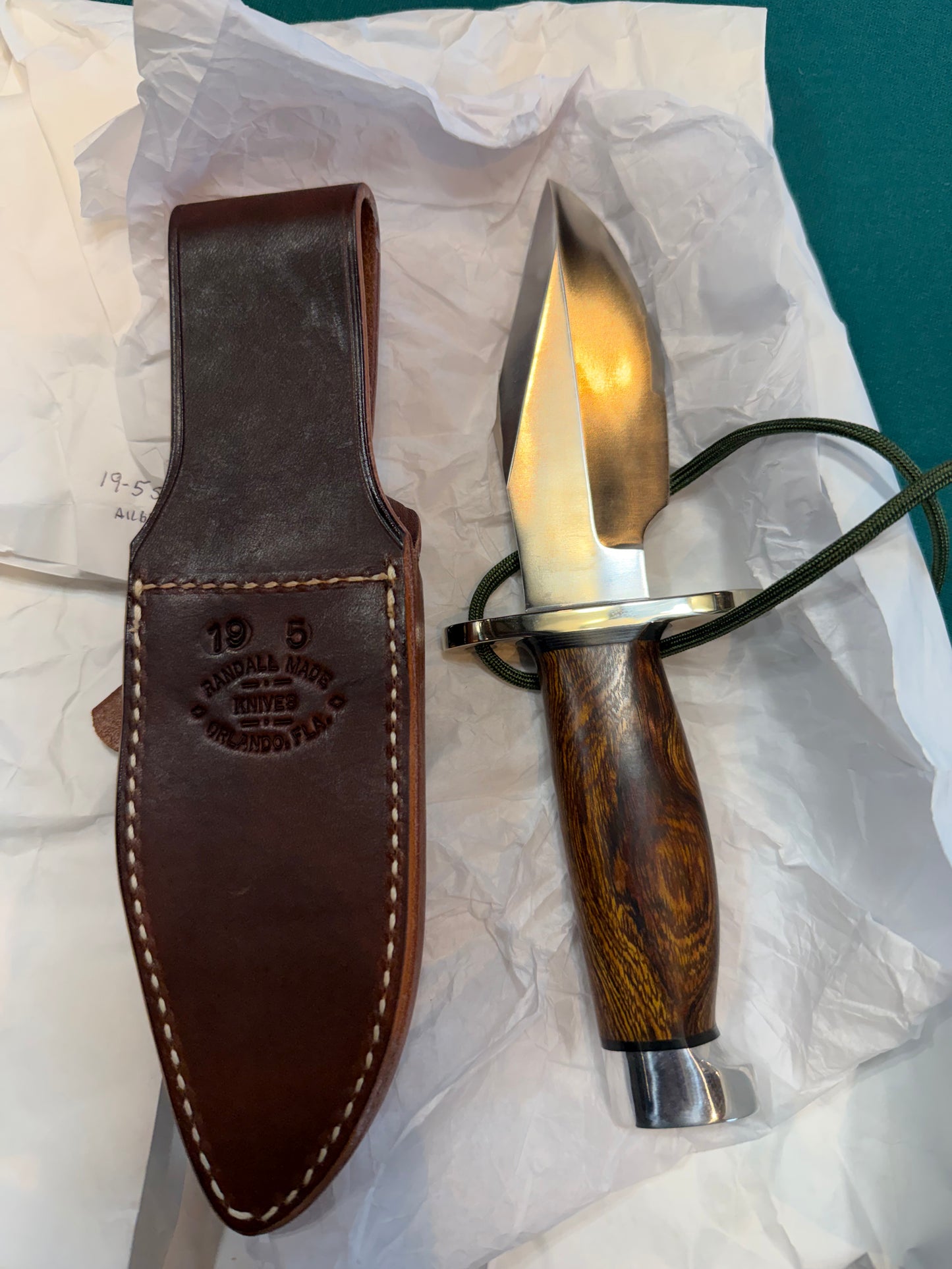 New in Paper Randall Model 19-5 with a nice piece of Ironwood. Nickel silver Hilt and Aluminum crows beak Butt cap.
