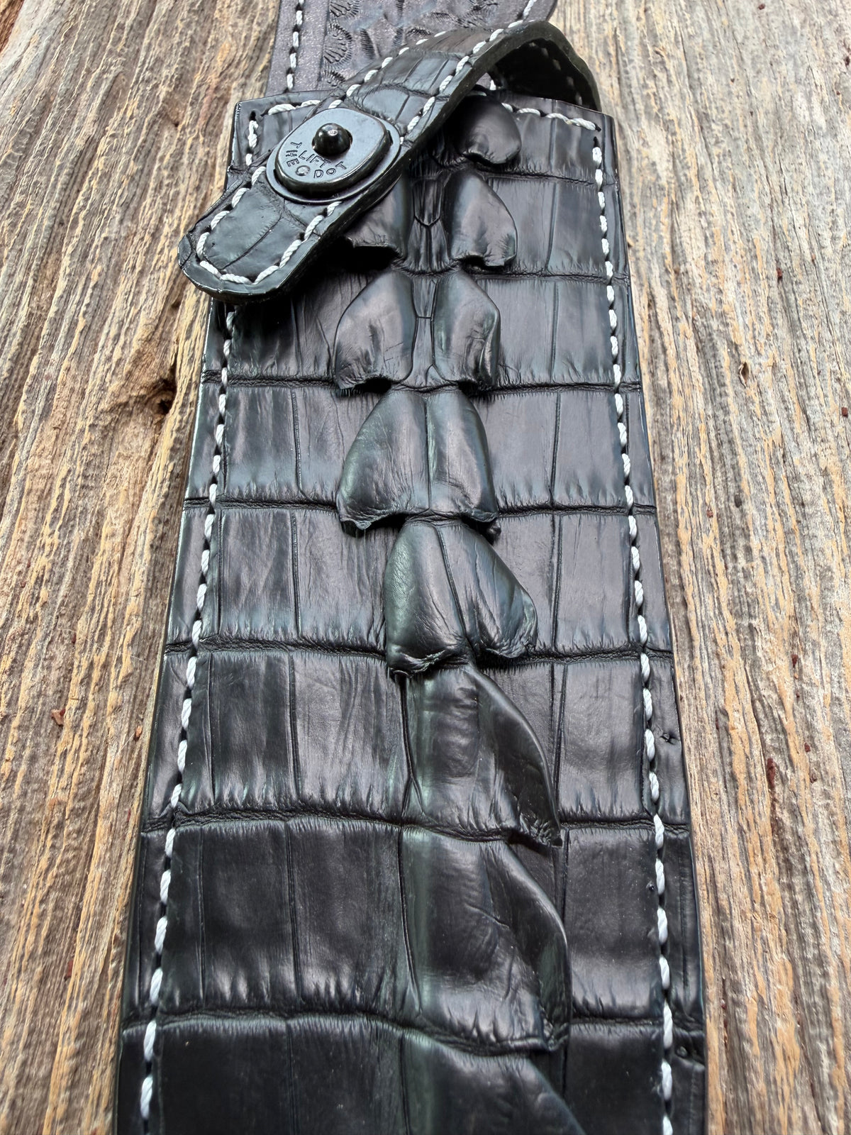 New Randall Model Clinton Special Sheath in Exotic Black Matte Crocodile tail from Treeman with a Black Canteen snap. White thread deviated stitching on black leather..Killer sheath.