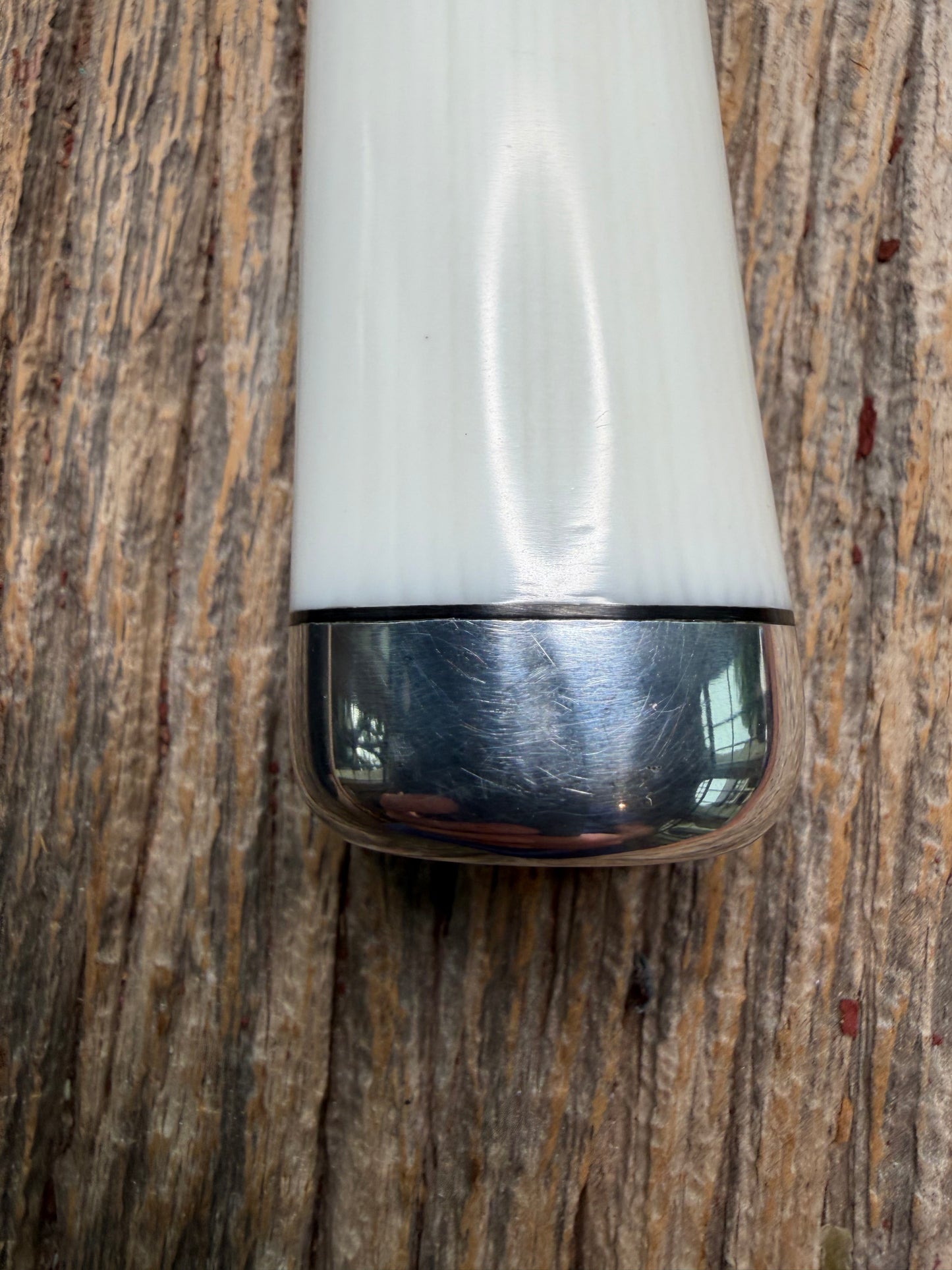 Randall Model 15 with a White Ivorite handle. Stainless steel blade, Nickel silver hilt and collar. Upgraded Black leather sheath.  Roundsd Aluminum butt cap.
