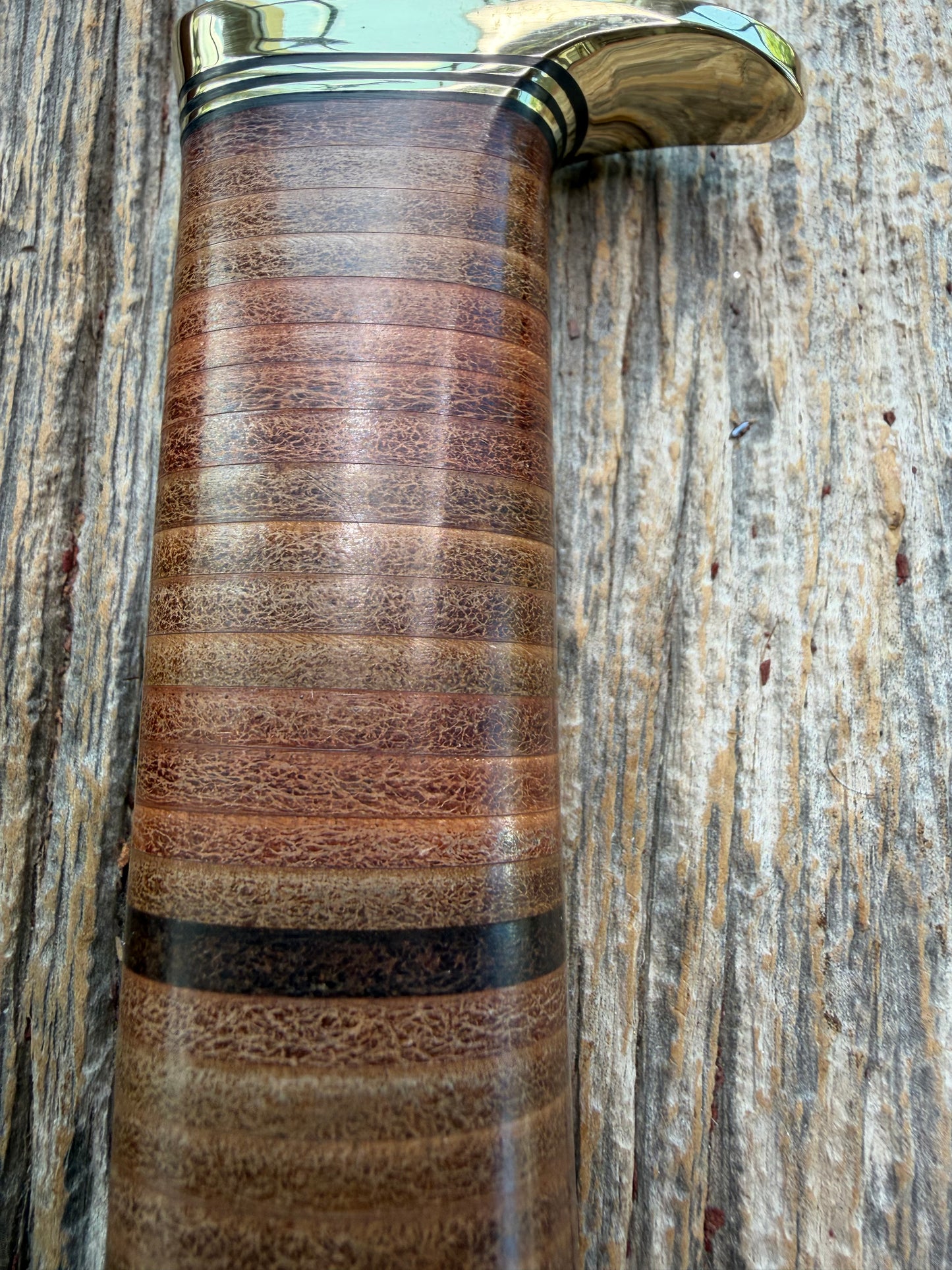 New Randall Model 19-5 Bushmaster with a Leather handle. Carbon blade, Brass single hilt. Brown leather sheath.