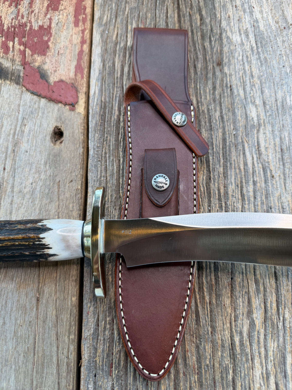 New in Paper Randall Model 12-8 Small Sasquatch with a really nice piece of stag. #1112, Nickel Silver collar and butt cap.