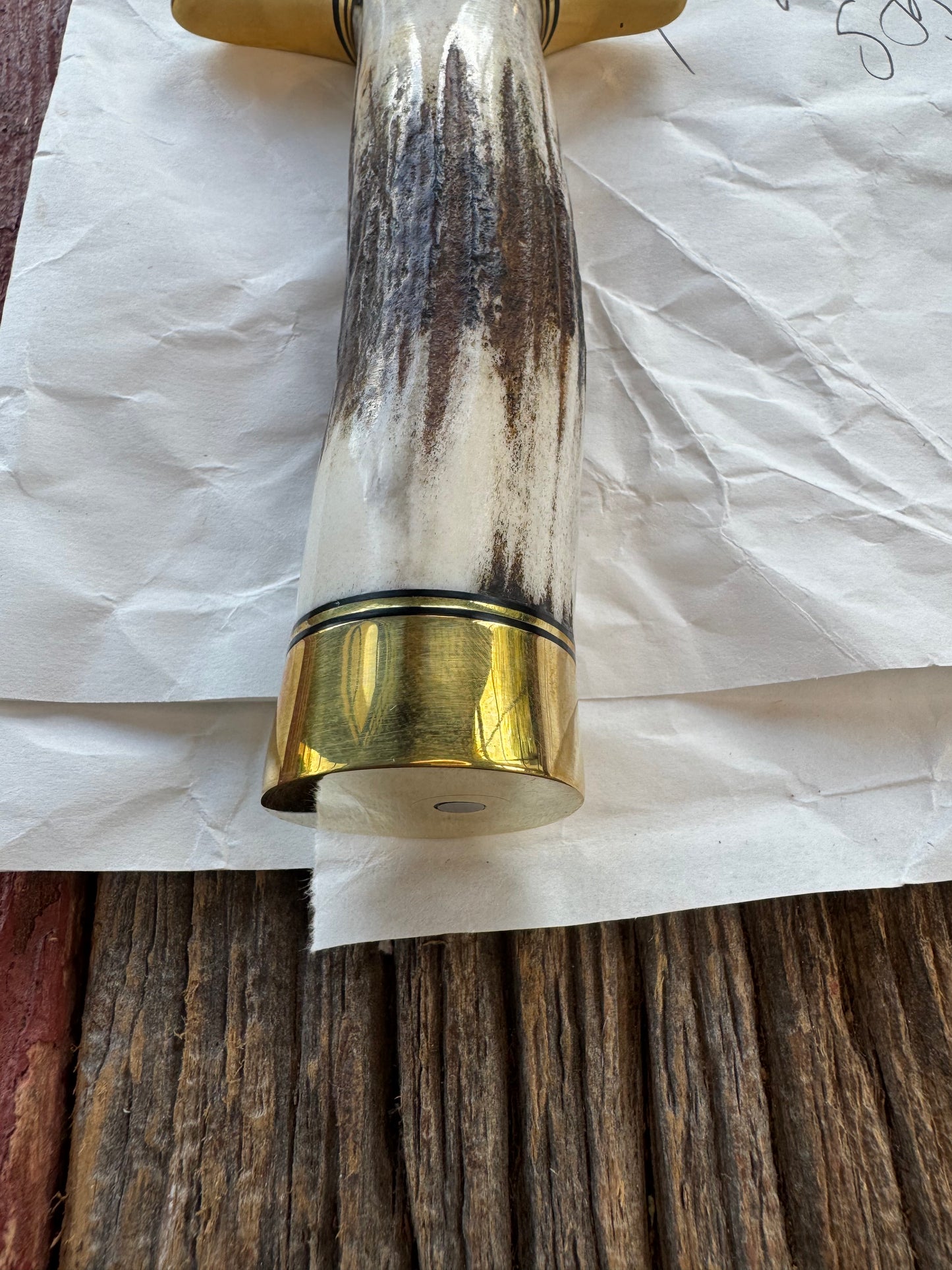 New in Paper Randall Knife Model 1-7 in Stag, Brass Hilt and Butt Cap, Black and Gold spacers.