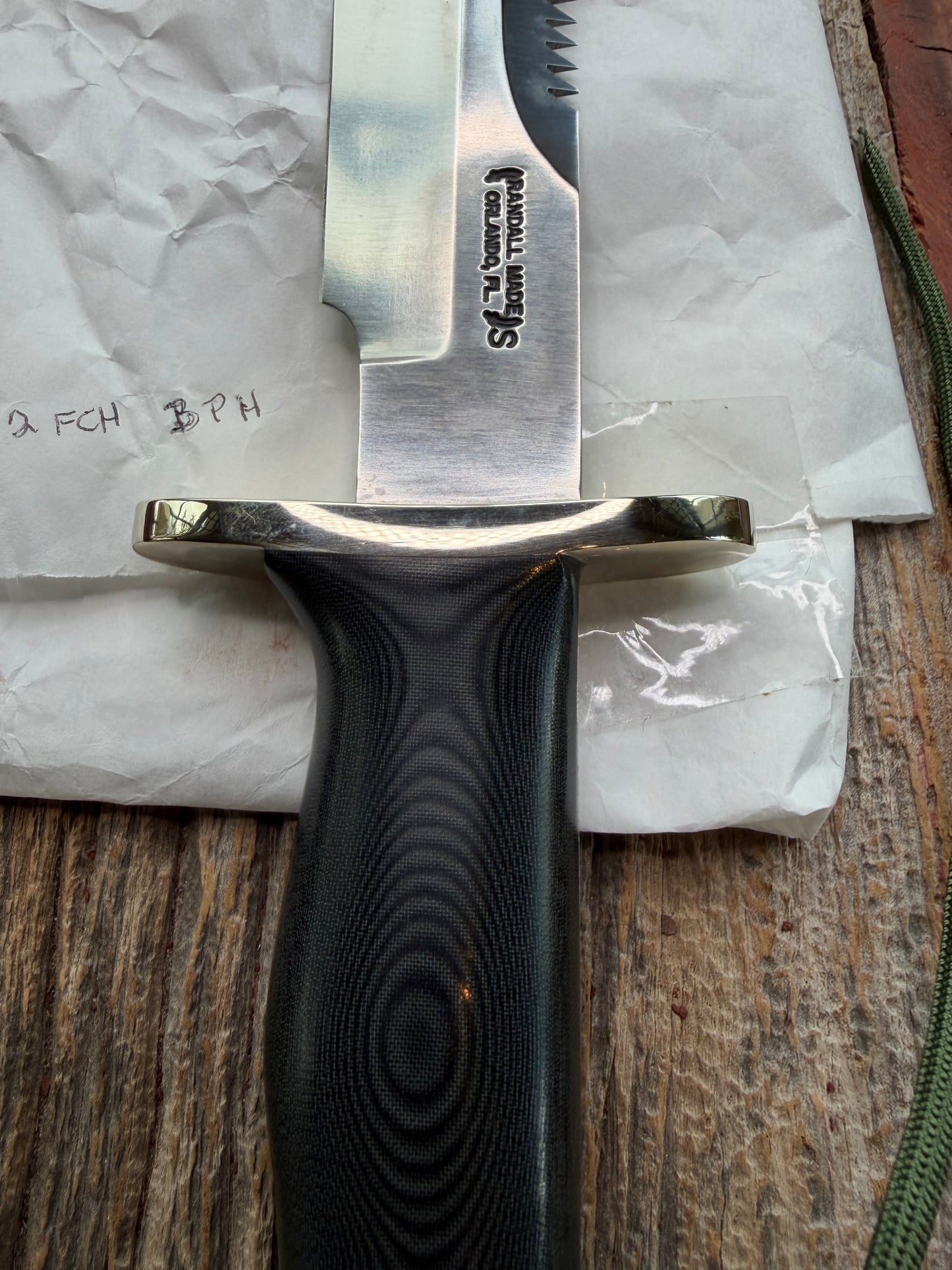 New in Paper Randall Model 14-7.5 in Black Micarta handle, Nickel Silver Hilt, Stainless steel, Sawteeth and Lanyard.