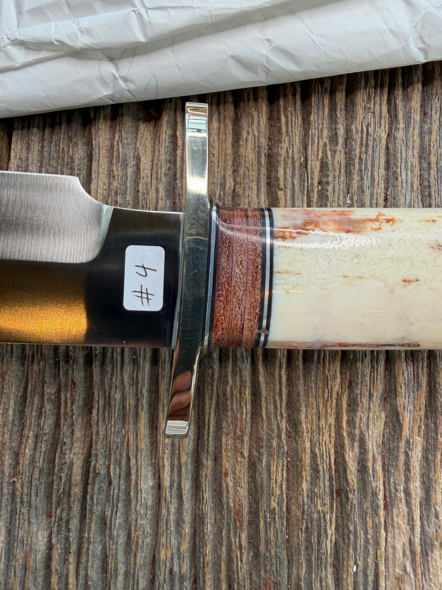 New in Paper Randall Model 12-9 Fossil Walrus Ivory and 25 style stacked Leather grip. Double Nickel Silver hilt and nickel butt cap.