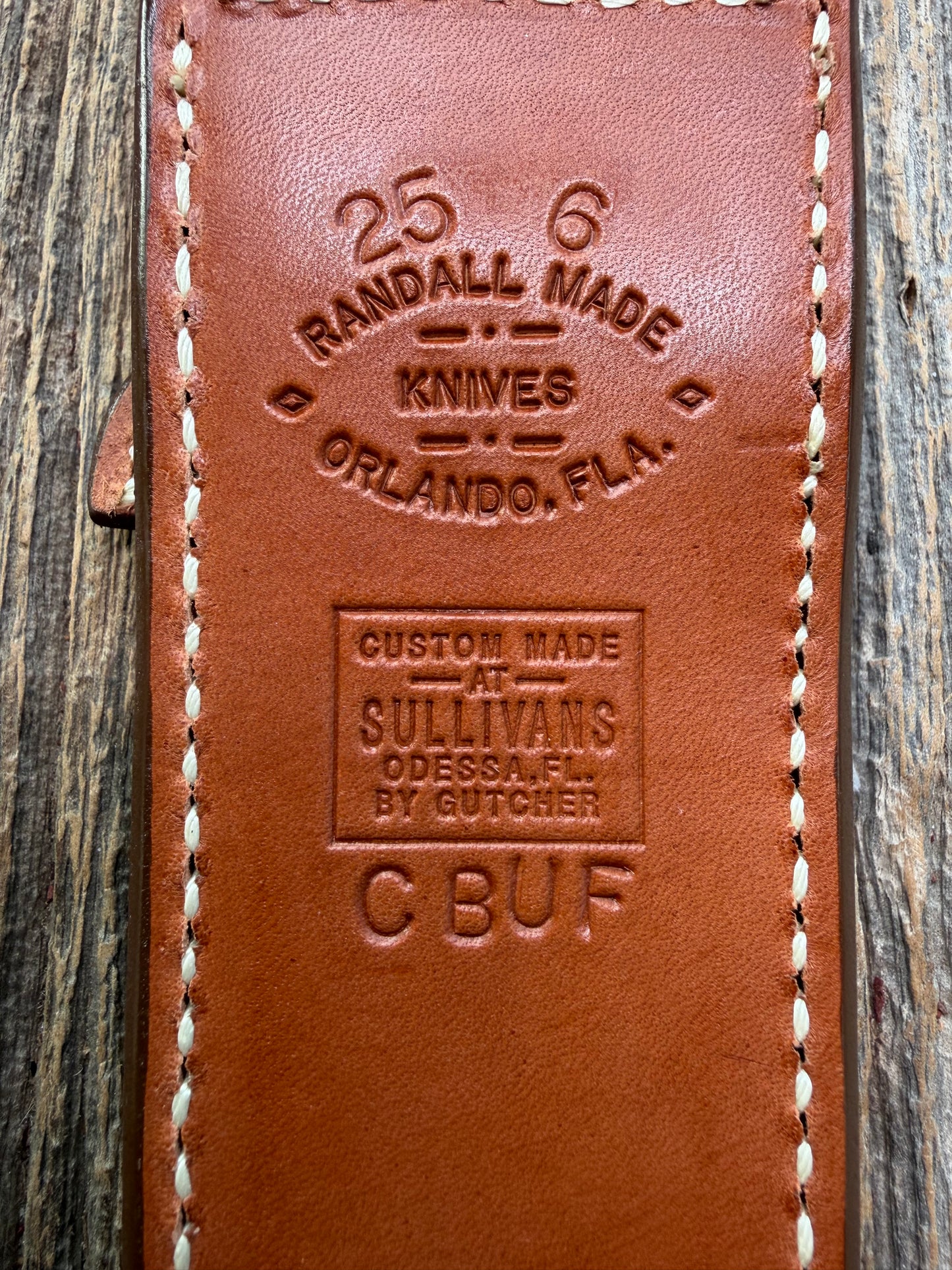 Pristine Randall Model 25-6 sheath in Exotic Cape Buffalo leather from Sullivans by Gutcher. Heavily tooled belt loop and strap. Randall snap and clean stamping on the back … perfect!!
