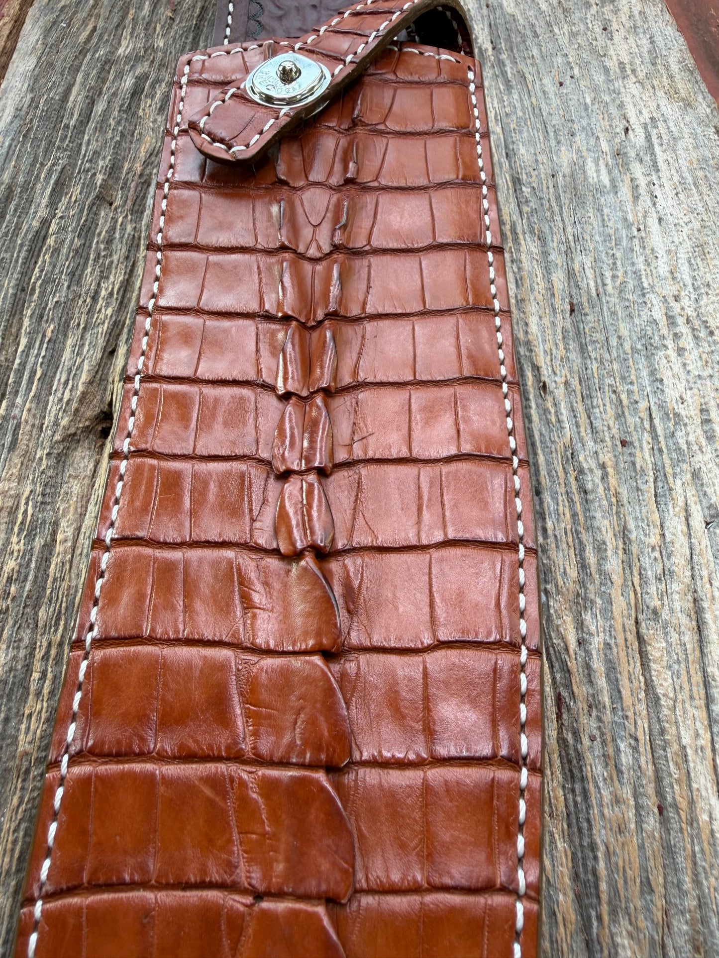 New Randall Model 12-11 Large Sasquatch Sheath in Exotic thick and textured Honey Crocodile skin ( tail portion) on brown leather from Treeman with a silver Canteen snap. Hand tooled belt loop. Killer sheath.