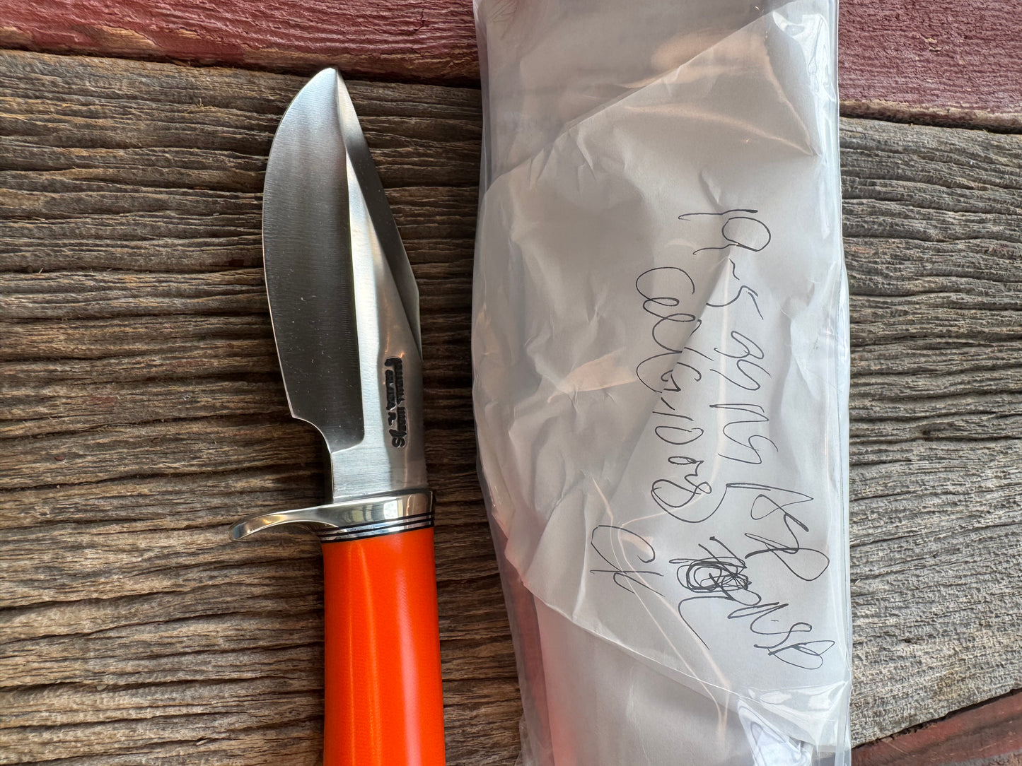 New in paper Randall Model 19-5 with a nice piece of customer supplied Orange G10. Stainless Steel, Nickel Silver Hilt and Butt cap.