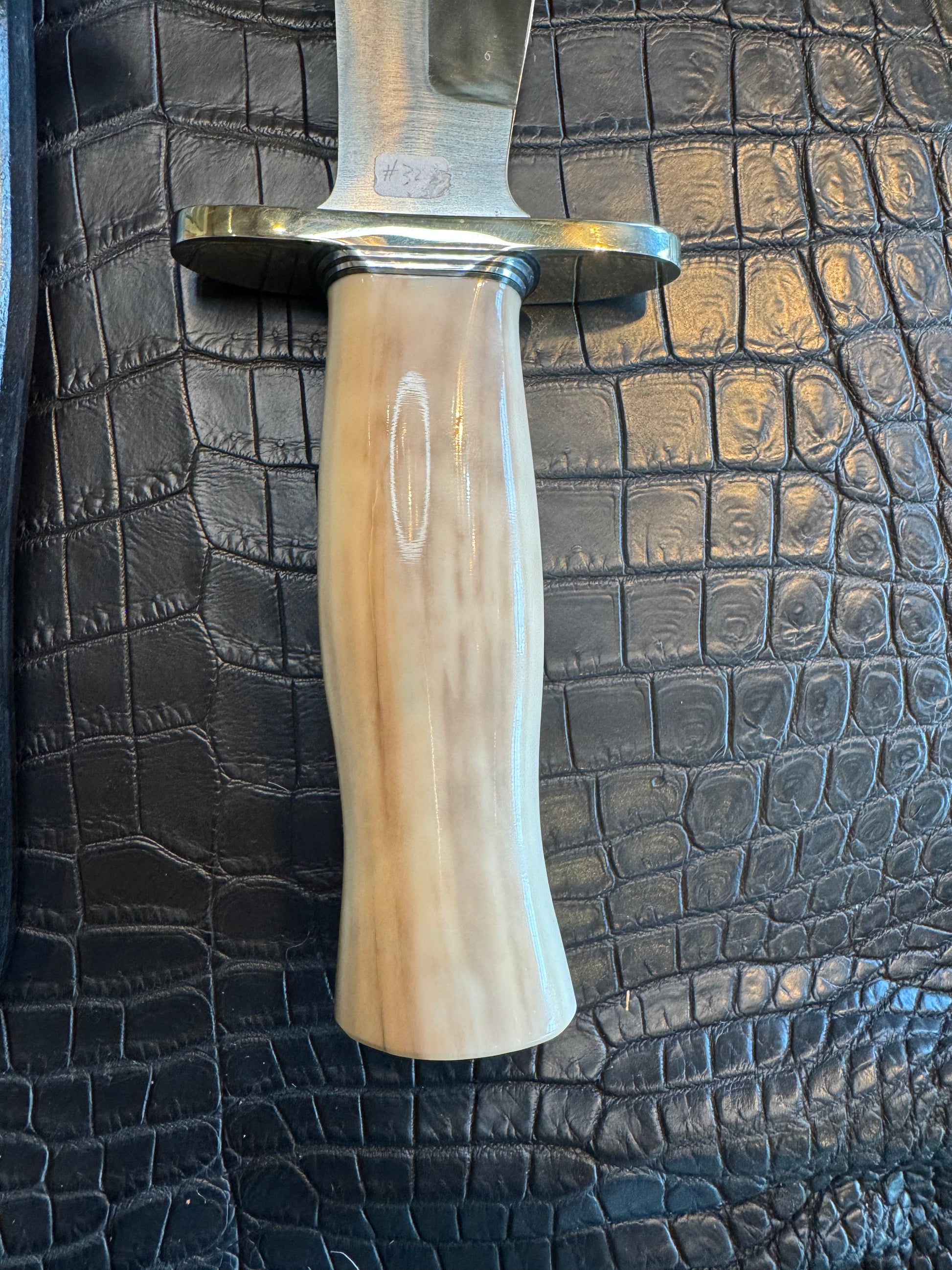 Randall Model 12-8 Big Bear in a gorgeous piece of Creamy Fossil Walrus Ivory. Nickel Silver Hilt and a natural exposed end.