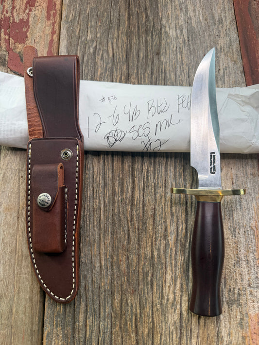New in Paper Randall Model 12-6 Little Bear with a Maroon Micarta handle. Brass Hilt  and Brass collar Carbon steel, natural end.