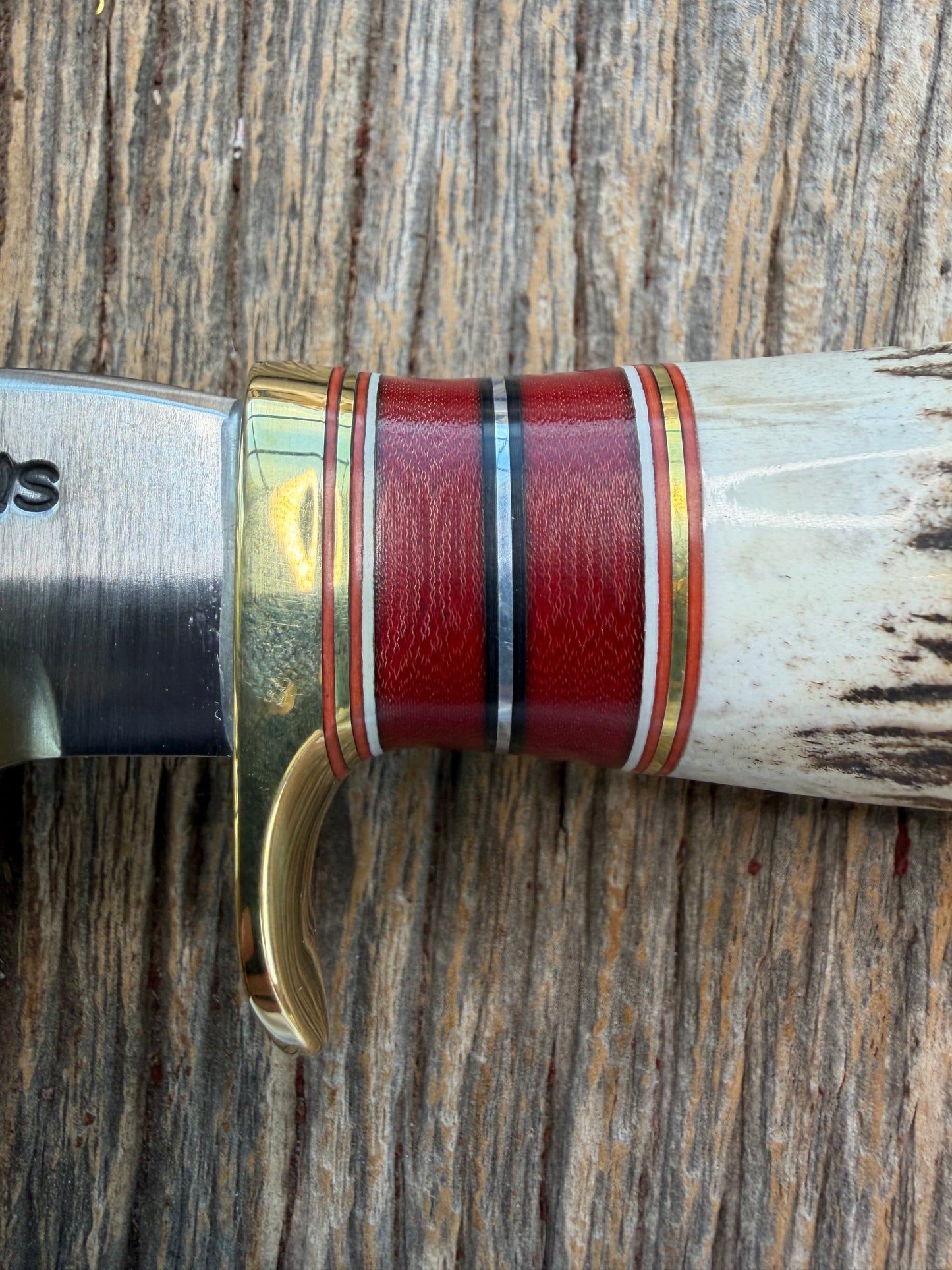 New in Paper Randall Made Knife Model 27-5 with a Stag handle, Stainless, brass single Hilt, red and aluminum spacers, loaded!!