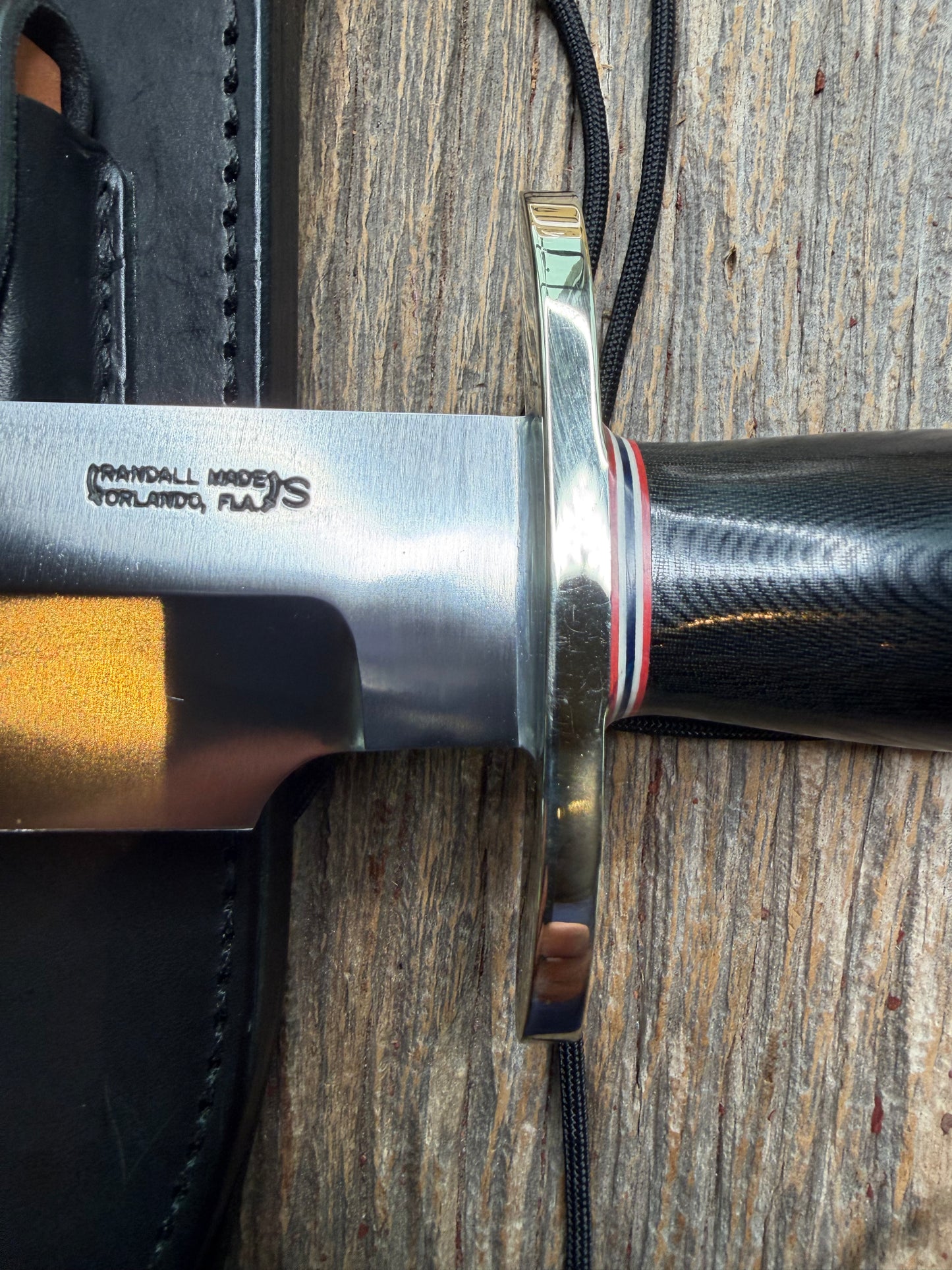 Nice Randall Model 12-9 in black Micarta handle. Red white and Blue spacers, Double Nickel Silver hilt, aluminum butt cap. Stainless blade.