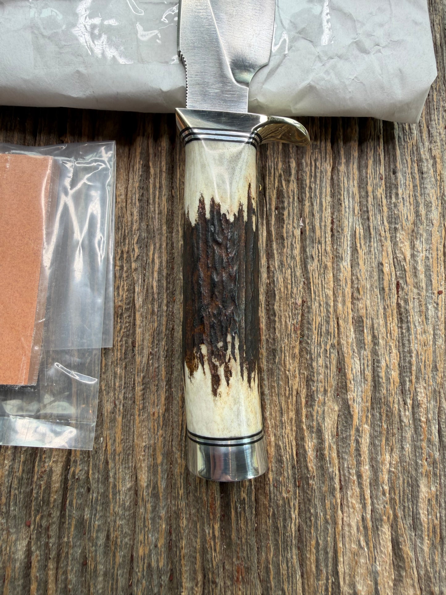 New in Paper Randall Made Knife Model 11-4 with a Stag handle, Stainless, Nickel silver single Hilt, Black and aluminum spacers.