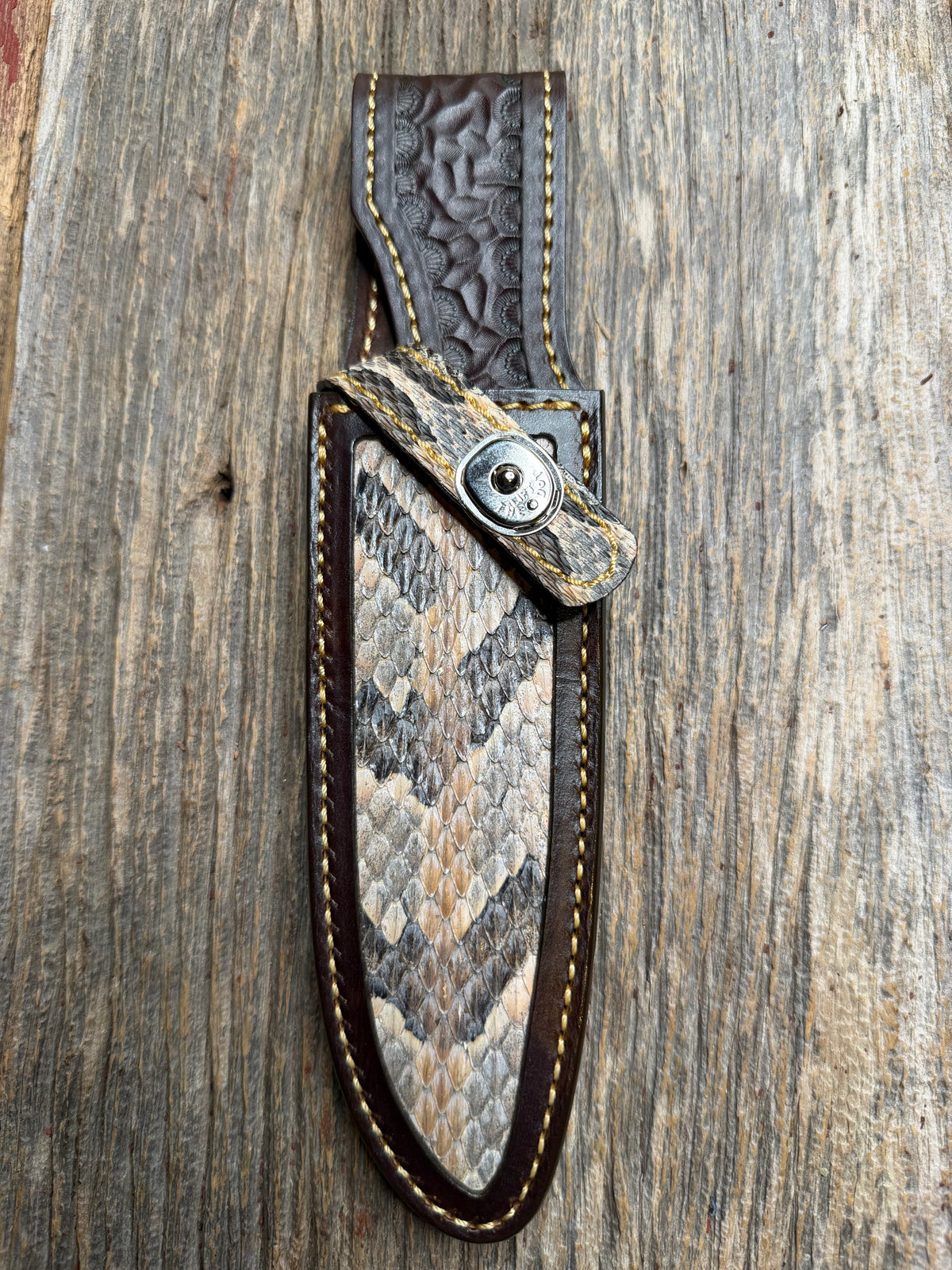 Randall Model 25-6 sheath with a Canebrake RattleSnake skin from Treeman Sheaths. Vibrant colors and along side Copperheads the hardest skin to source.