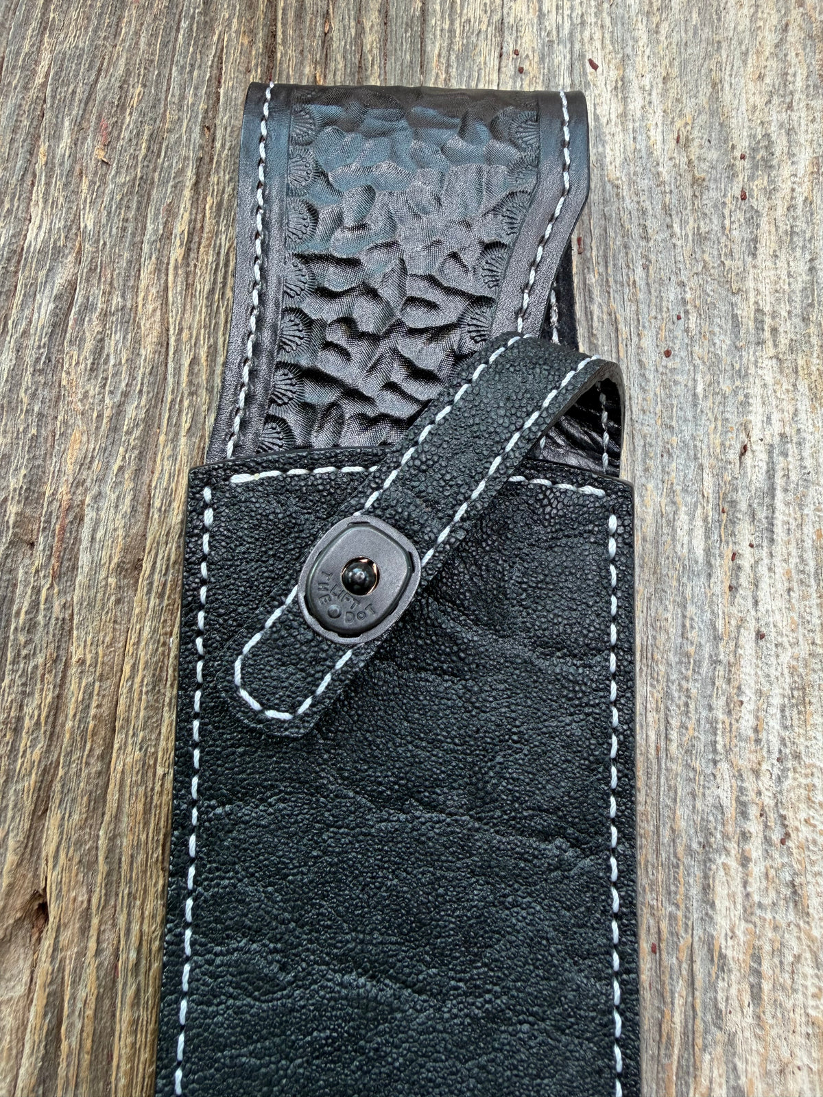 New Randall Model Smithsonian Sheath in Exotic Black Matte Elephant Hide from Treeman with a Black Canteen snap. White thread deviated stitching on black leather..Killer sheath.
