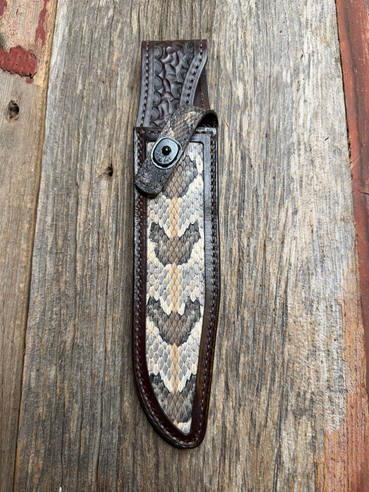 Randall Model 1-8 sheath with a Canebrake RattleSnake skin from Treeman Sheaths. Vibrant colors and along side Copperheads the hardest skin to source.