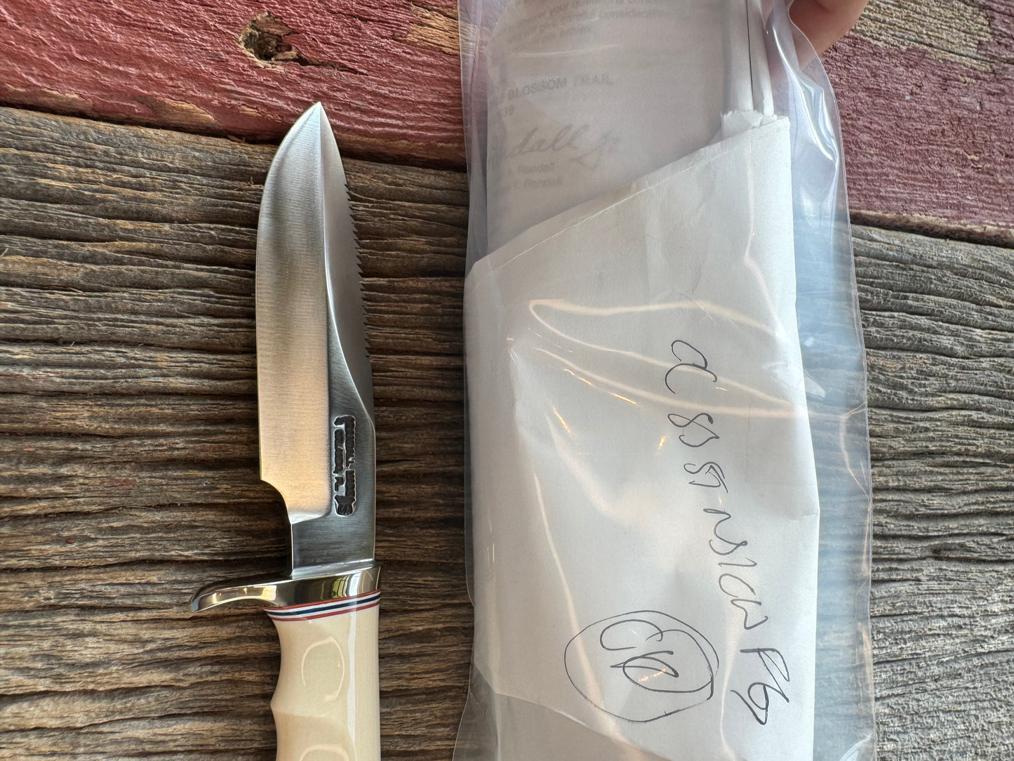 Randall Model Combat Companion with a nice piece of customer supplied Warthers Resin with finger grooves. Teeth, Stainless Steel, Nickel Silver Hilt and a raw natural end.