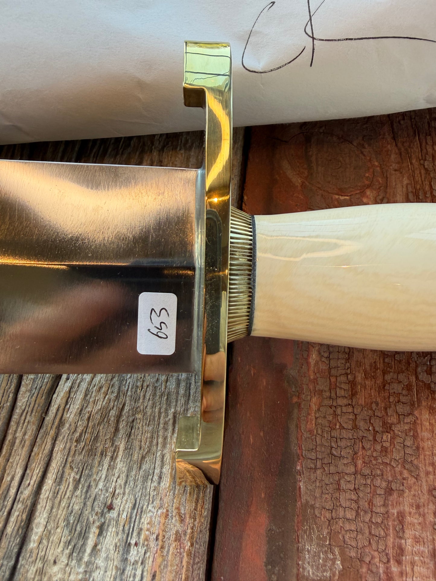 New in Paper Model 12-11 Smithsonian “ Smitty” Beautiful Dave Warthers Resin with a Brass Lugged hilt and Scalloped brass collar and scalloped coolie butt cap.