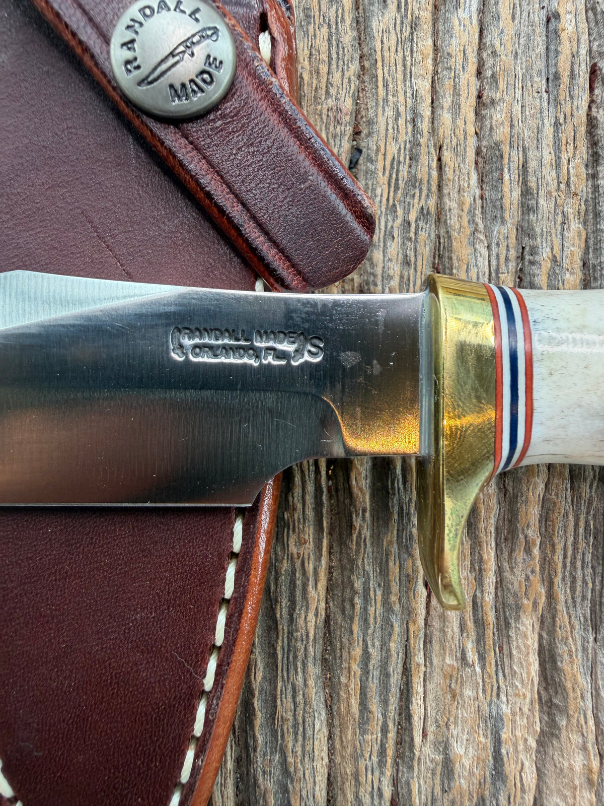 New Randall Model 8-4 with a Stag handle. Stainless steel blade, brass single hilt and natural butt. Red white and Blue spacers.