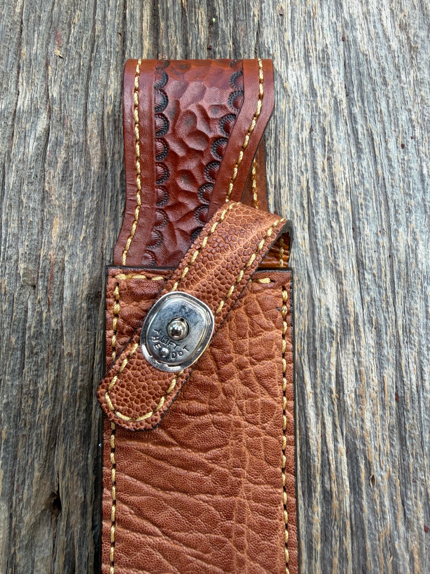 New Randall Model 1-7 Sheath in Exotic thick and textured Rust colored Elephant hide on brown leather from Treeman with a silver Canteen snap. Hand tooled belt loop. Killer sheath.