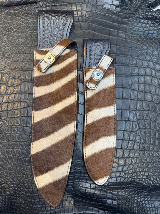 A pair of Randall Model 12-11 Large Sasquatch and Randall Model 12-8 Small Sasquatch Sheaths in Exotic Zebra by Treeman.