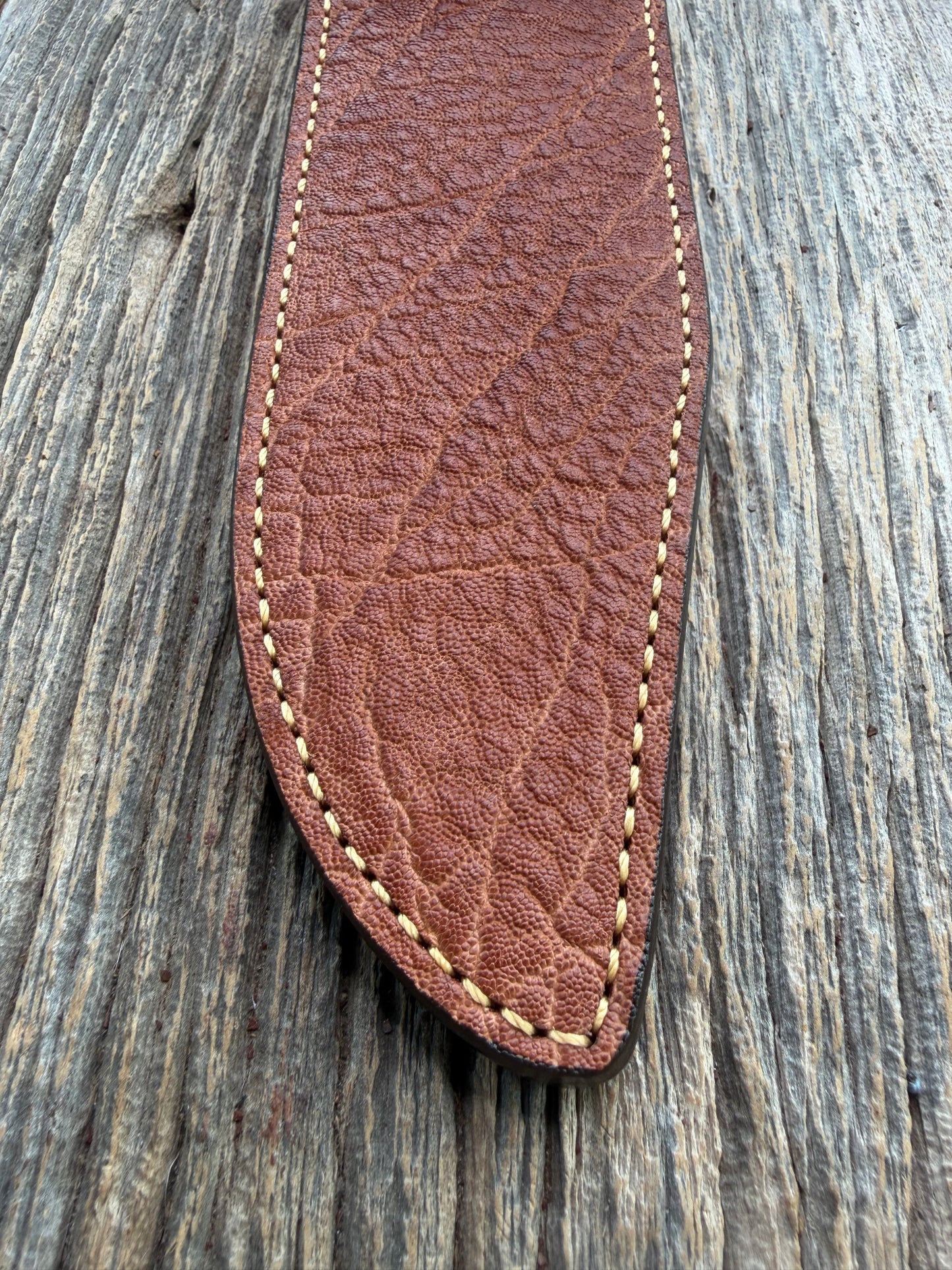 New Randall Model 12-9/14 Sheath in Exotic thick and textured Rust colored Elephant hide on brown leather from Treeman with a silver Canteen snap. Hand tooled belt loop. Killer sheath.
