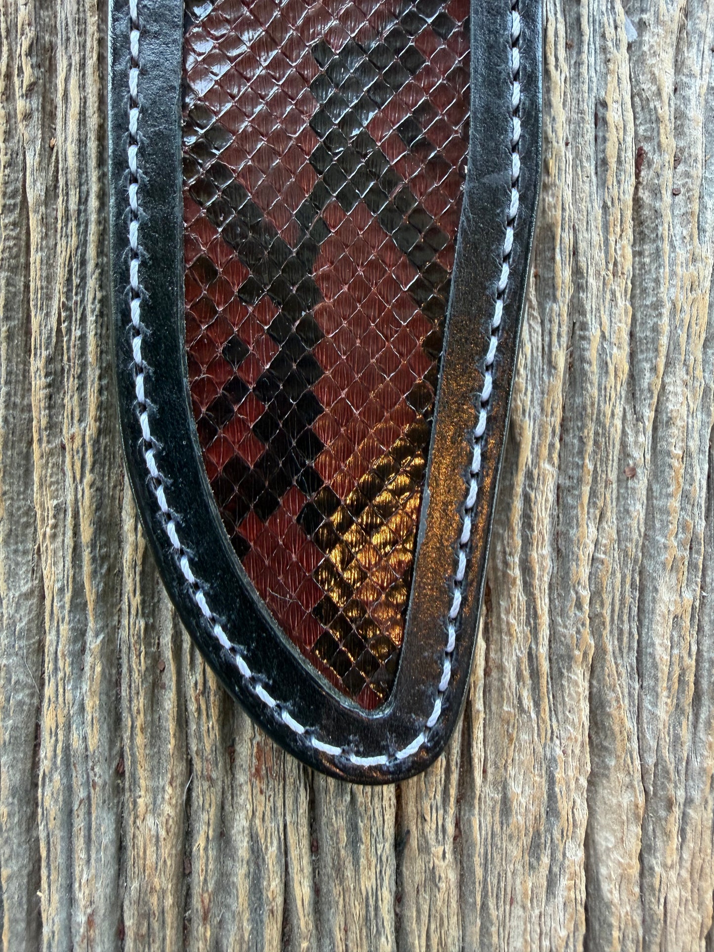 New Randall Model 1-6 Sheath in Exotic Brown Python Snake skin on black leather from Treeman with a black Canteen snap. Hand tooled belt loop. Deviated white stitching. Killer sheath.