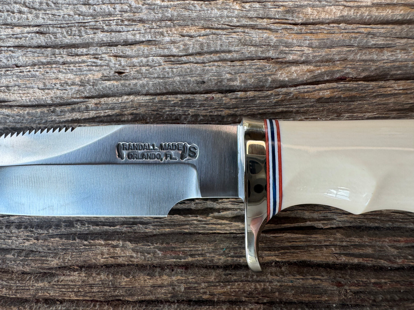 Randall Model Combat Companion with a nice piece of customer supplied Warthers Resin with finger grooves. Teeth, Stainless Steel, Nickel Silver Hilt and a raw natural end.